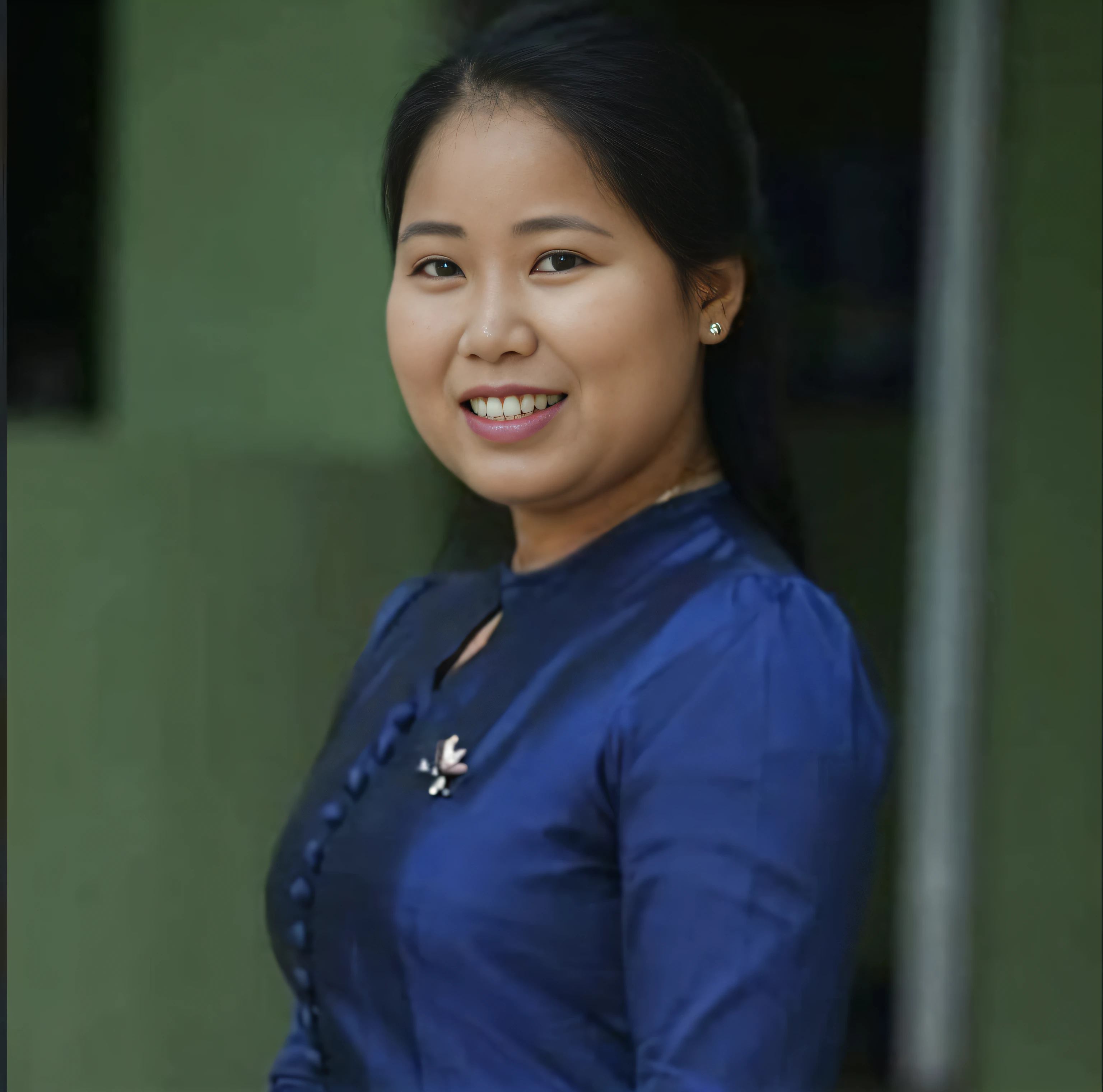 arafed woman in blue dress smiling at camera with green wall, nivanh chanthara, nuttavut baiphowongse, photo taken in 2 0 2 0, south east asian with round face, 3 0 years old woman, 30 years old woman, photo of a woman, taken in the early 2020s, facebook