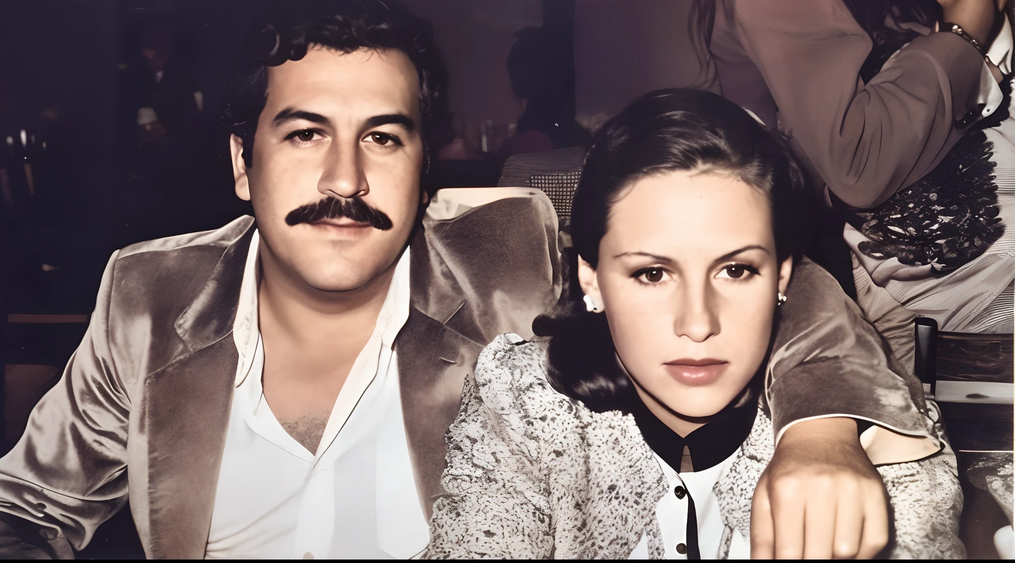 there are two people sitting next to each other Pablo Escobar, victoria eugenia henao at a table, historical picture, 📷 mungojerrie and rumpleteazer, momma and papa, a colorized photo, circa 1982, circa 1 9 8 4, circa 1 9 7 9, 1 9 7 9, 1979, portrait of two people, 1978