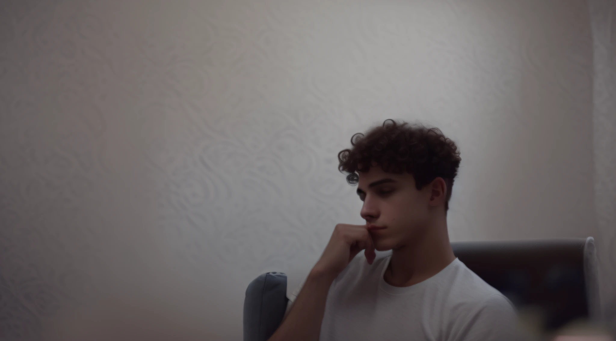 there is a man sitting in a chair with his hand on his chin, low quality photograph, very very low quality picture, curls on top of his head, low quality photo, low quality grainy, 18 years old, curls on top, around 1 9 years old, very very low quality, from 8 k matte, curly and short top hair