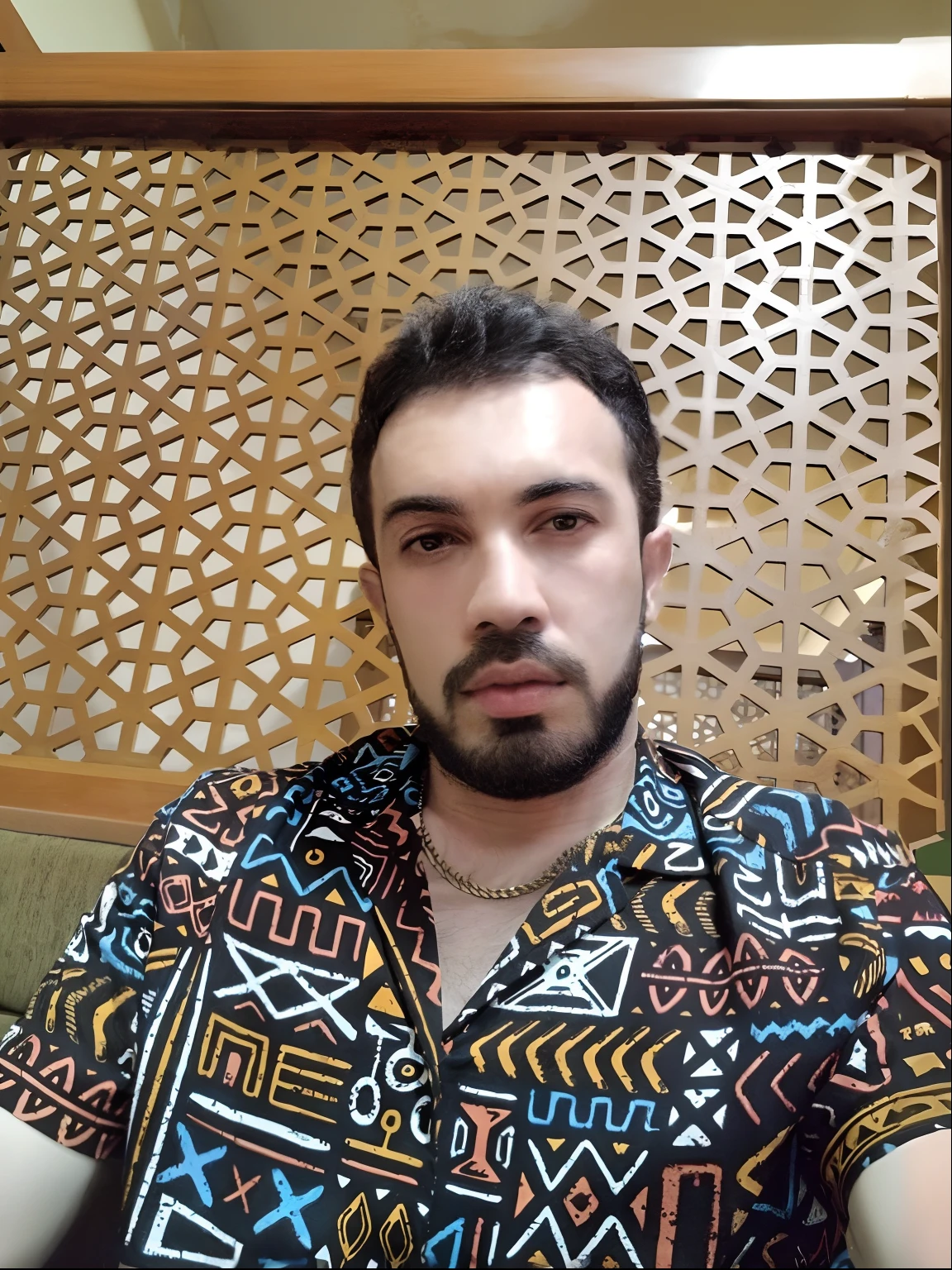 arafed man with a beard and a colorful shirt sitting on a couch, aykut aydogdu, ismail, aykut aydogdu zener, riyahd cassiem, enes dirig, around 1 9 years old, profile picture 1024px, saâdane afif, eytan zana, profile pic, profile image, profile photo