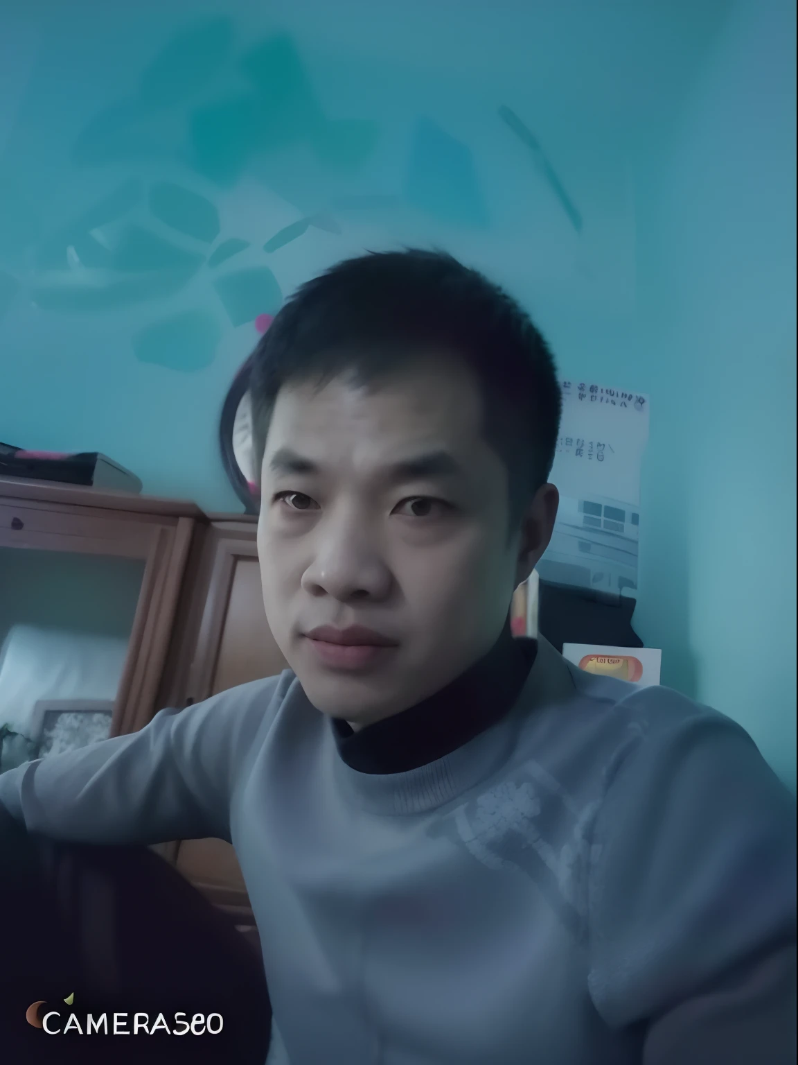 there is a man sitting in a room with a remote control, hoang long ly, nivanh chanthara, dang my linh, bao pham, phong yintion j - jiang geping, dzung phung dinh, nuttavut baiphowongse, ngai victo, quy ho, dao trong le