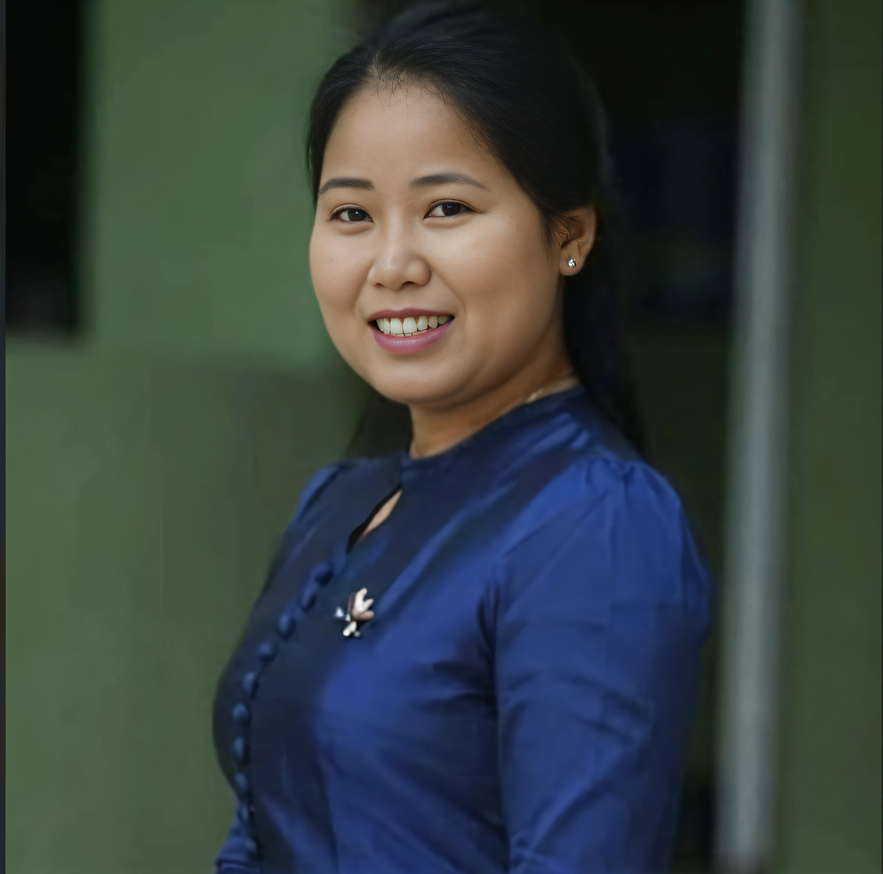 arafed woman in blue dress smiling at camera with green wall, nivanh chanthara, nuttavut baiphowongse, photo taken in 2 0 2 0, south east asian with round face, 3 0 years old woman, 30 years old woman, photo of a woman, taken in the early 2020s, facebook