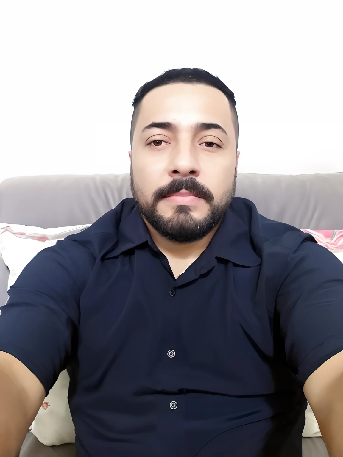 Man with beard sitting on a sofa with remote control, Emad Mostaque, andres rios, imagem de perfil, Ahmad Merheb, Hicham Habchi, Eloy Morales, david rios ferreira, imagem de qualidade muito baixa, Salustiano Garcia Cruz, Mohamed Chahin, Jose Miguel Romano Francisca, victor maristane, Arauto Ortega