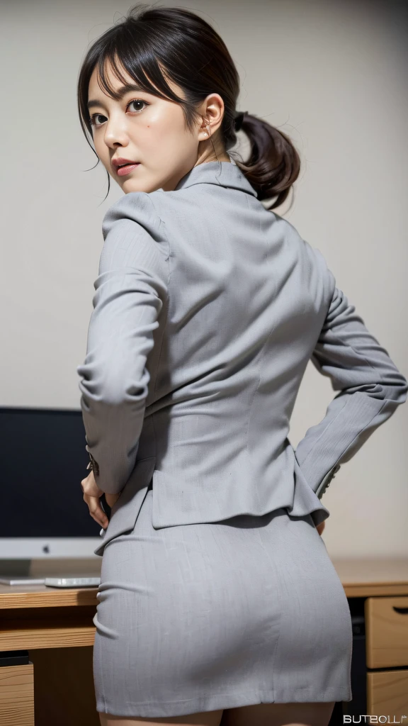 (Best quality, 8k, 32k, Masterpiece, UHD:1.2), from behind, 1girl, beautiy Japanese office lady, (looking at the viewer), bit chubby, grey suit, grey mini skirt, open jacket, office room, desk, (huge breasts, buttocks:1.2), detailed beautiful face, pony-tail hair, from below, raise one leg