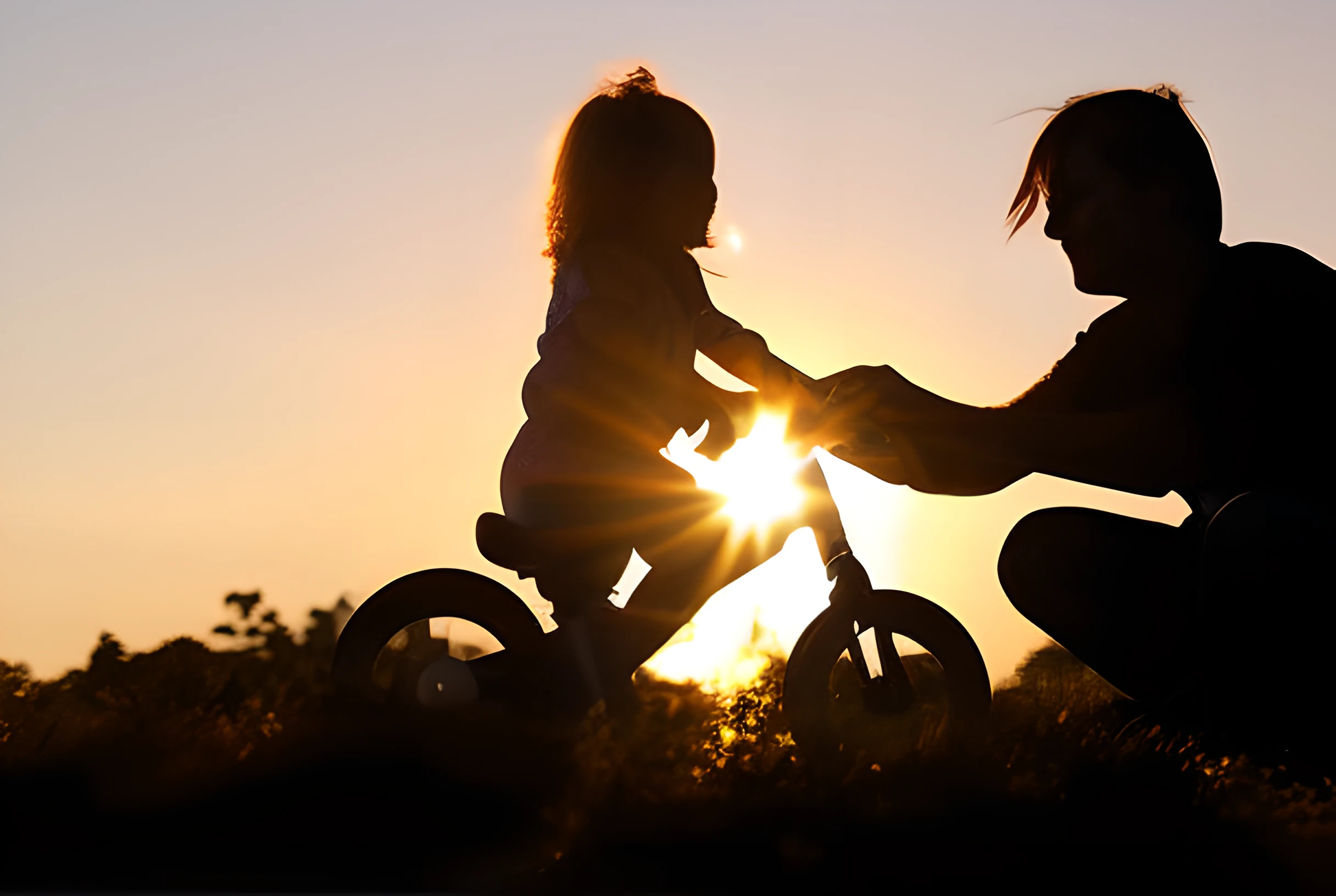 Teaching my daughter to ride her bike at sunset