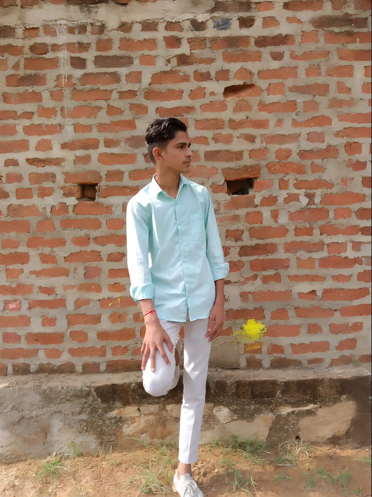 arafed man in a blue shirt and white pants standing in front of a brick wall, wearing a light blue shirt, with a cool pose, sea - green and white clothes, stylish pose, inspired by Saurabh Jethani, cool pose, * colour splash *, casual pose, wearing a kurta, wearing a linen shirt, leaning on the wall, candid picture