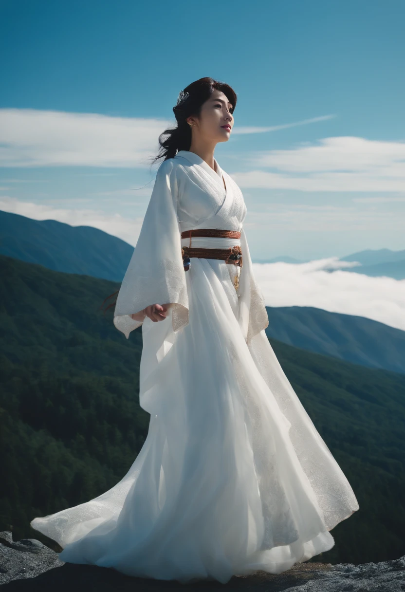 Princess Kikuri Hakuyama, a goddess standing in the sky above Mt. Hakusan that has become white with snow。Princess Kikuri's background is a cloudless blue sky。