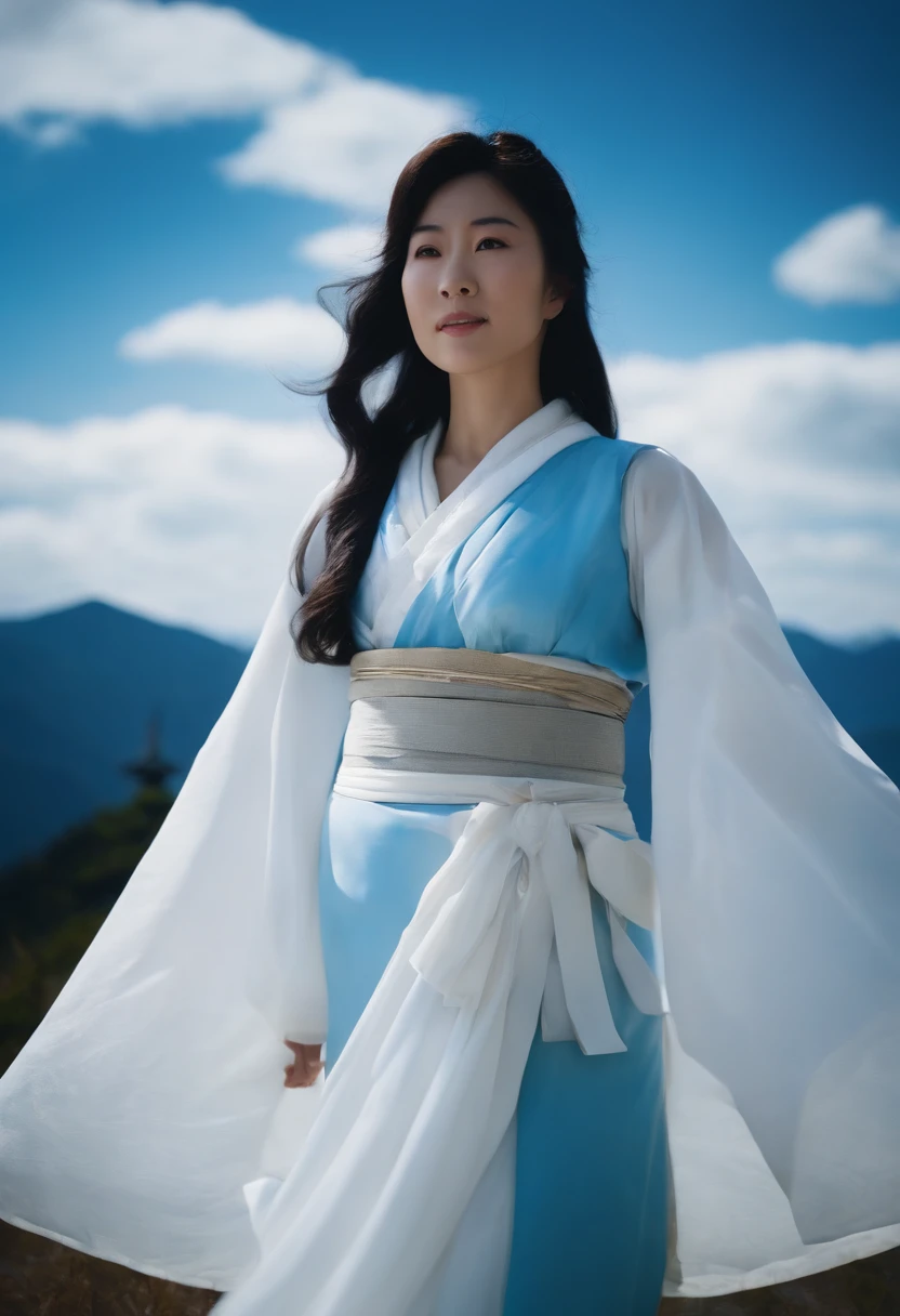 Princess Kikuri Hakuyama, a goddess standing in the sky above Mt. Hakusan that has become white with snow。Princess Kikuri's background is a cloudless blue sky。