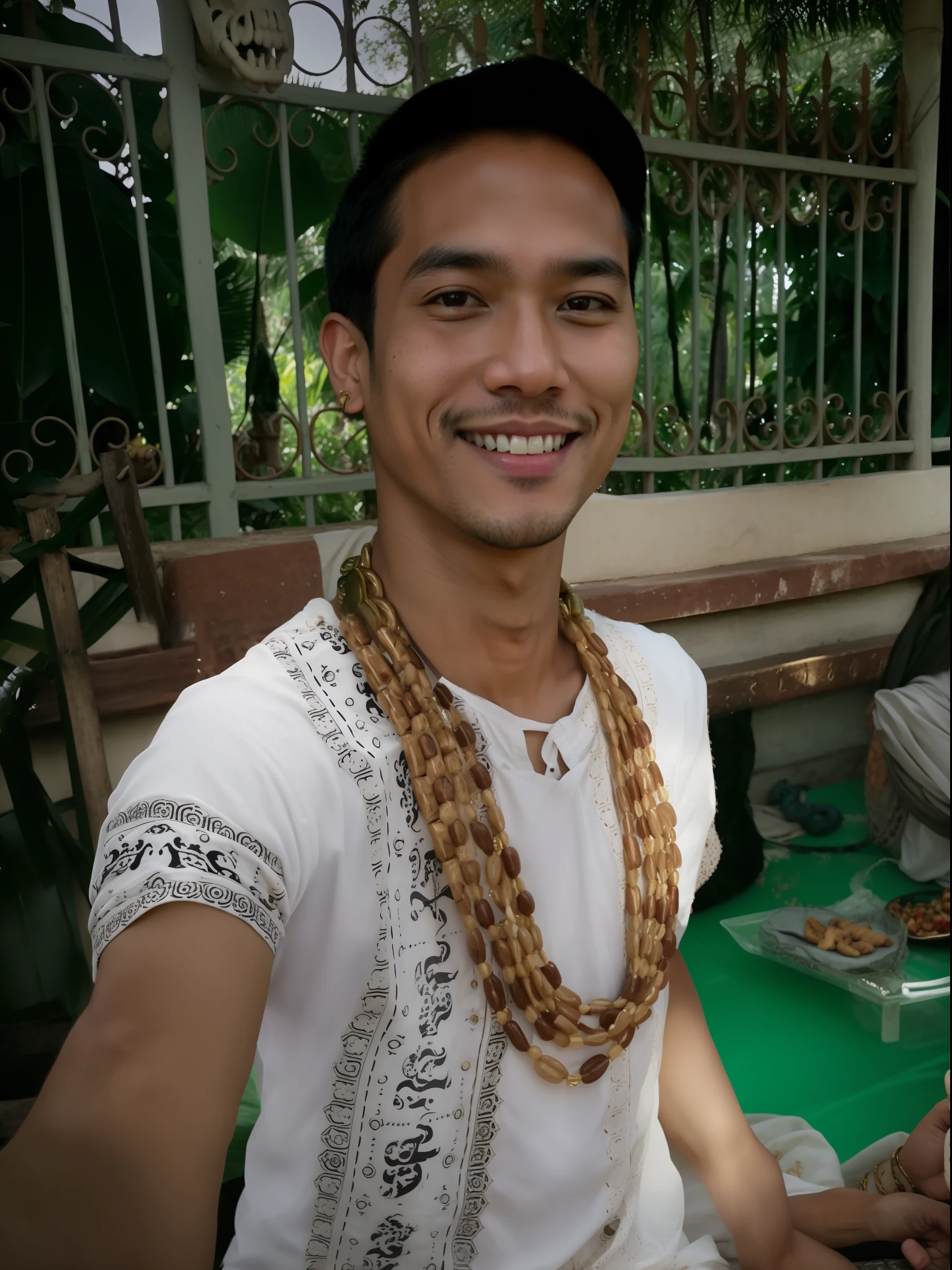 there is a man that is smiling and holding a plate of food, bone jewelry, very handsome, handsome chad chin, with snakes for hair, bone jewellery, sukhothai costume, with a beautifull smile, nivanh chanthara, inspired by Yosa Buson, wearing authentic attire, handsome man, with the head of a snake, beautiful man