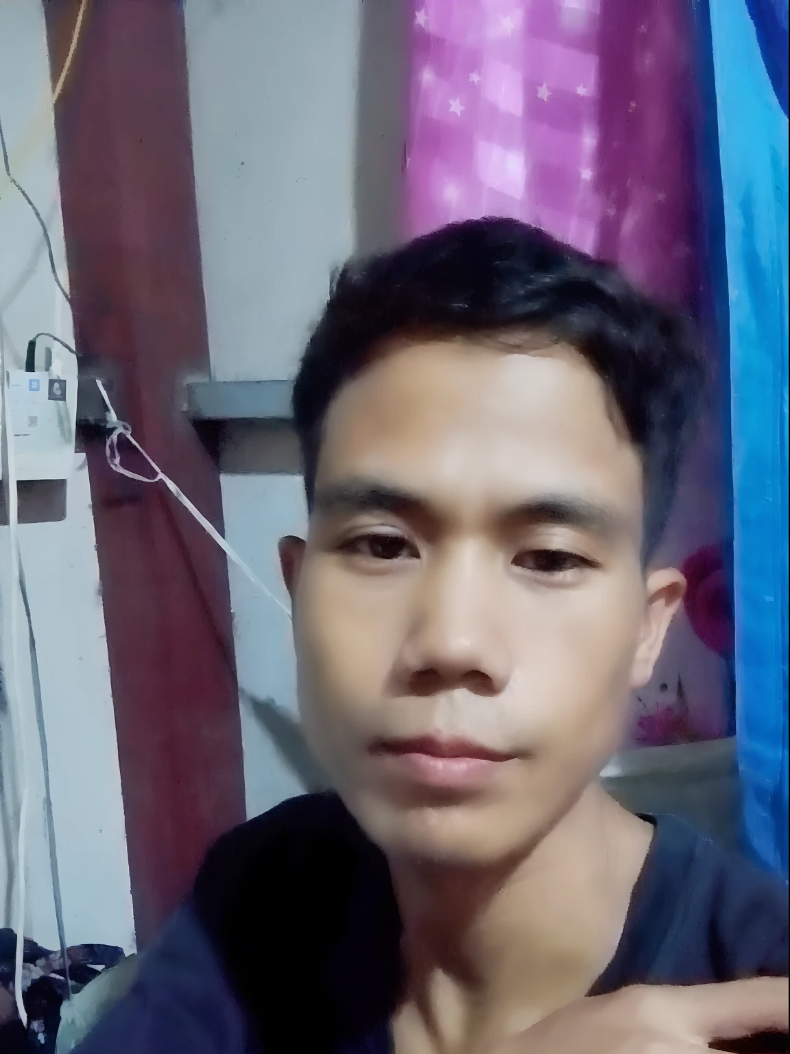 there is a man sitting in a room with a blue curtain, potrait, south east asian with round face, with accurate face, 2 7 years old, ayan nag, asian male, 4 0 years old man, picture, ramil sunga, 2 8 years old, 2 3 years old, thawan duchanee, 2 4 -  - old man