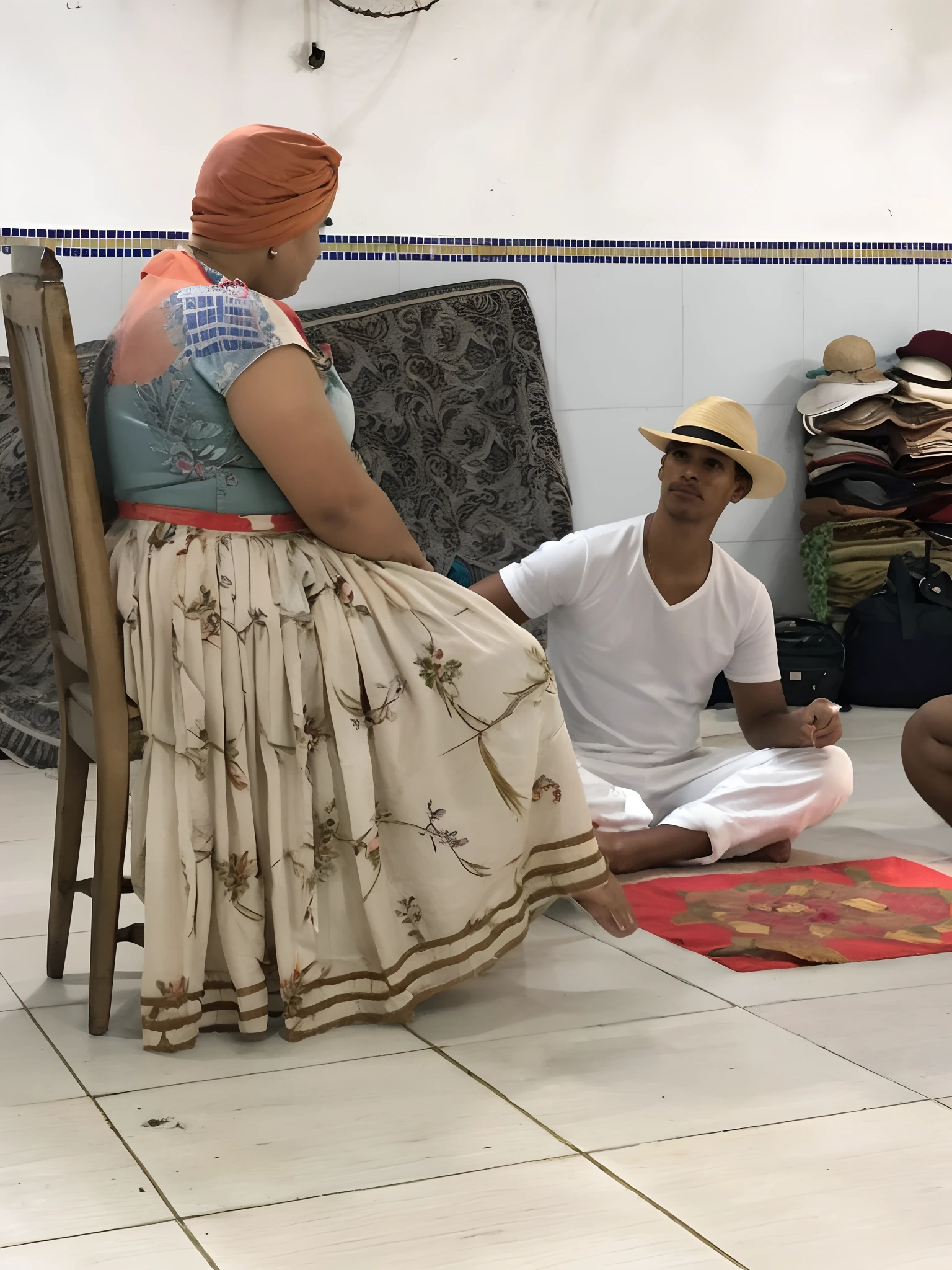 There are two people sitting on the floor of a room, roupas tradicionais, Directed by: Nandor Soldier, Mulheres cubanas em Havana, traditional clothing, Directed by: Judith Gutierrez, Directed by: Caro Niederer, por Ingrida Juniper, Directed by: Jakob Gauermann, Directed by: French Victoria, traje tradicional, vendendo seus produtos, Directed by: Daniel Lieske