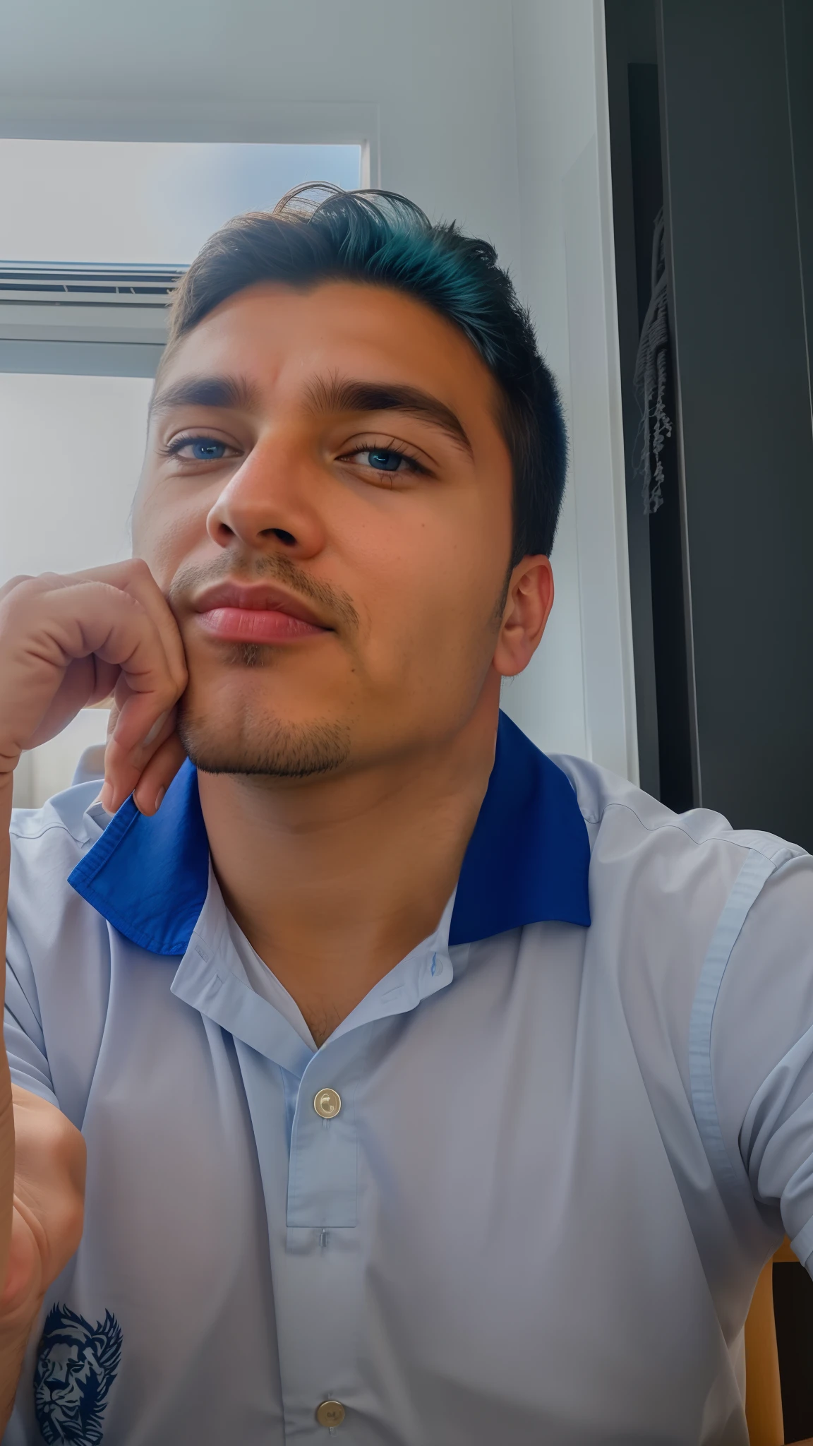 There is a man sitting at a table with his hand supporting his face and his eyes on fire blue with the aura of a blue lion