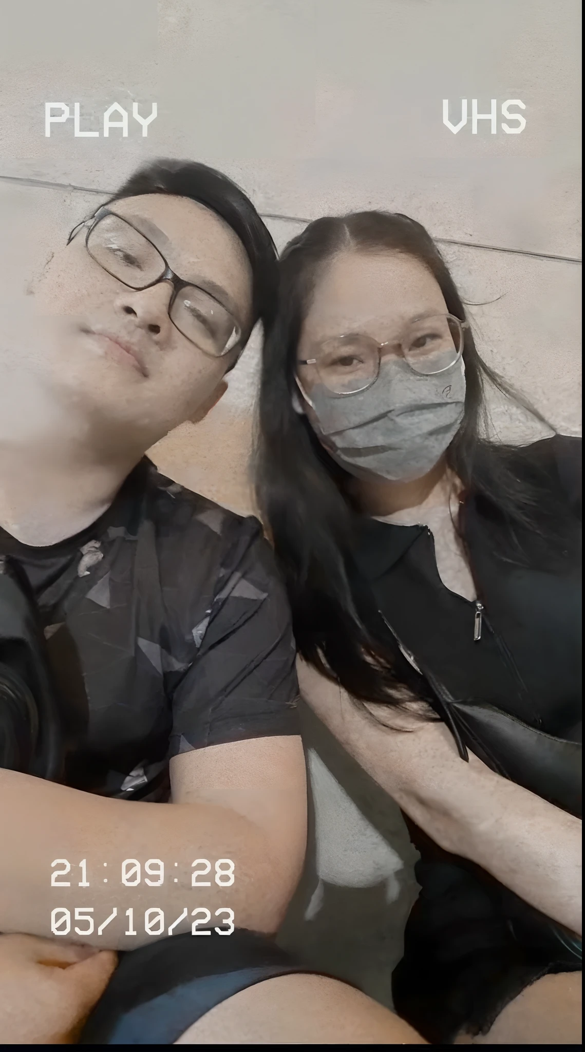 there are two people sitting next to each other with a camera, ruan jia and brom, wearing facemask and sunglasses, wearing all black mempo mask, tyler edlin and natasha tan, 8k selfie photograph, wearing mask, with wart, with her long, grainy low quality, profile image, ruan jia and fenghua zhong