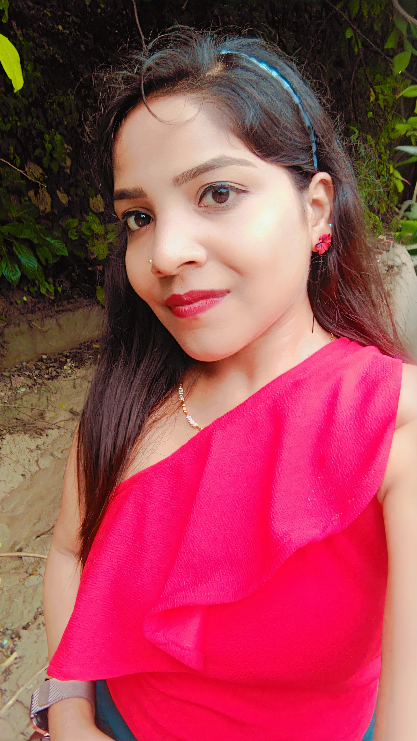 there is a woman in a red dress posing for a picture, 28 years old woman, 28 years old woman, profile image, very very low quality picture, candid picture, with accurate face, in red background, by Gina Pellón, by reyna rochin, wearing red dress, wearing a red dress, wearing gold chain, beutifull