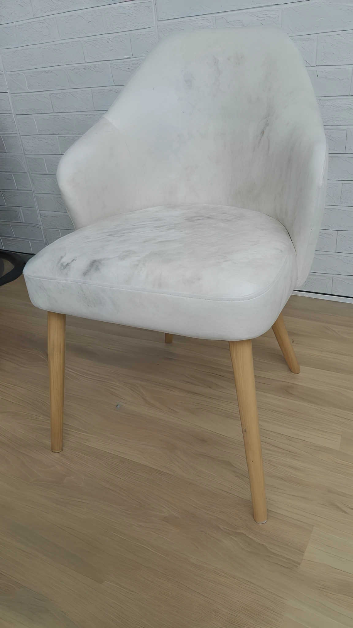 there is a chair that is sitting on a wooden floor, curved furniture, 6 0 s chair, chair, marble white complexion, armchairs, single chair, armchair, cozy arm chairs, white soft leather model, comfy chairs, chairs, furniture photography, detailed zoom photo, in a comfortable chair, edited, heavy two tone shading, froggy chair, wood carved chair