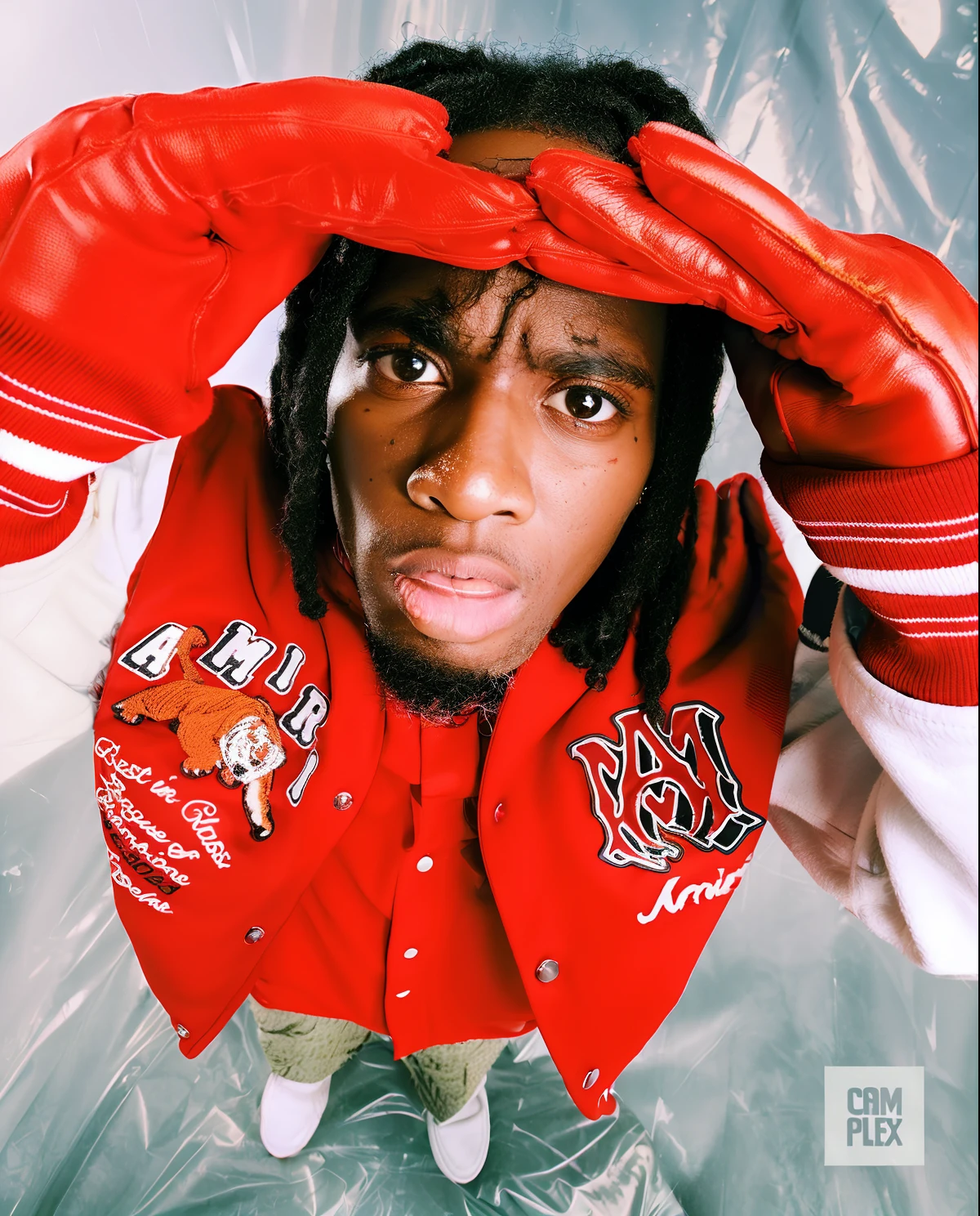 there is a man with a red jacket and gloves on, young thug, chief keef, crazy eyes, lil wayne, album art young thug, travis scott, sicko, playboi carti portrait, holding it out to the camera, illustrative!!, 👁🌹👾, crazy eyes wide open, lil uzi vert, tyler the creator