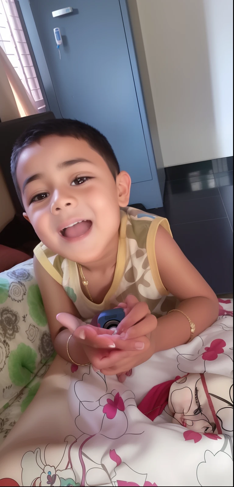 there is a young boy laying on a bed with a remote control, ayan nag, he is very happy, she is smiling and excited, she expressing joy, mutahar laughing, cute boy, ruan cute vtuber, arham horror, he is 3 , reyyan, excited expression, kid named finger, with a happy expression, 16k