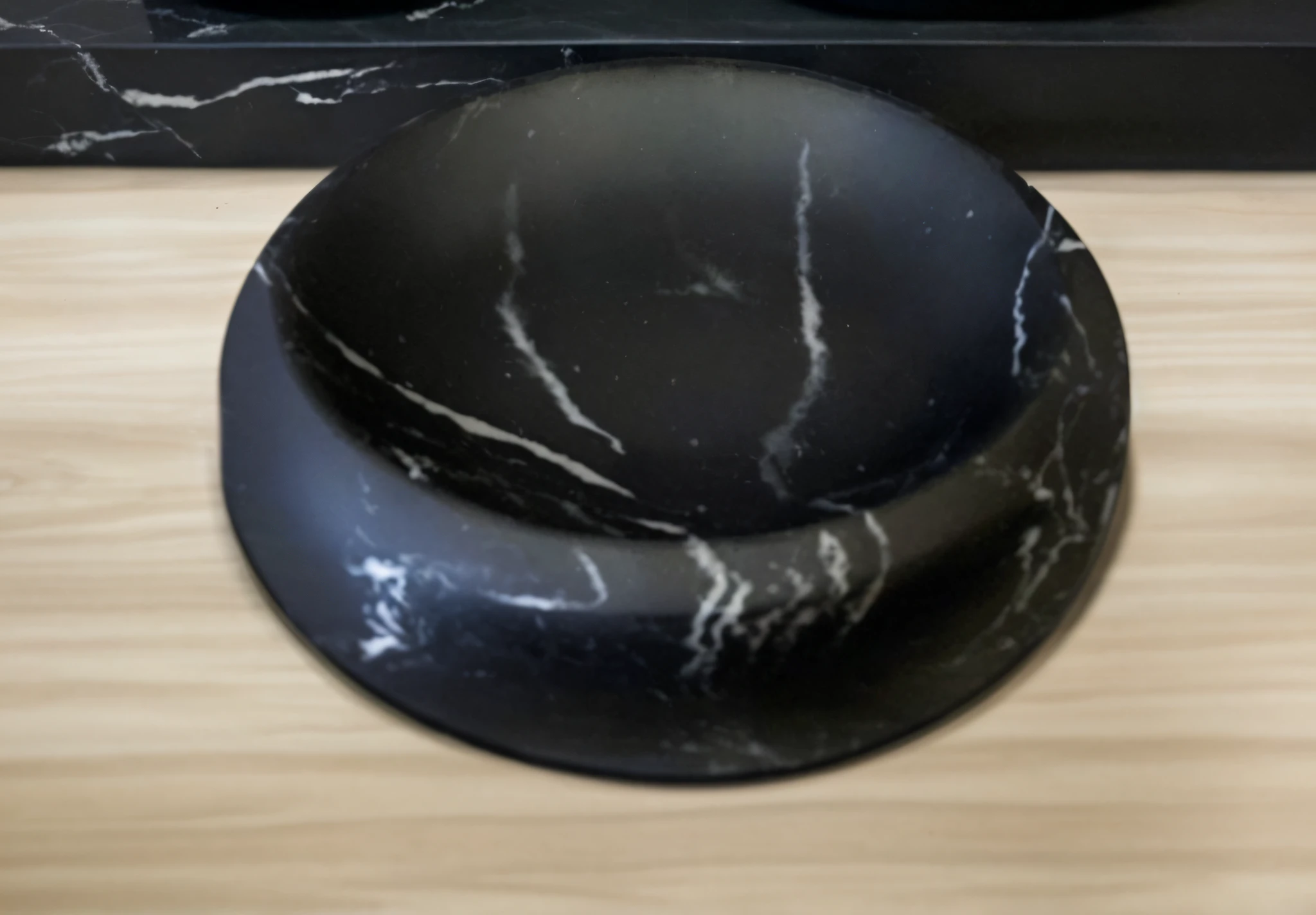 On a wooden table there is a bowl of black marble, soap dish, light, eye shadow, Professional shooting