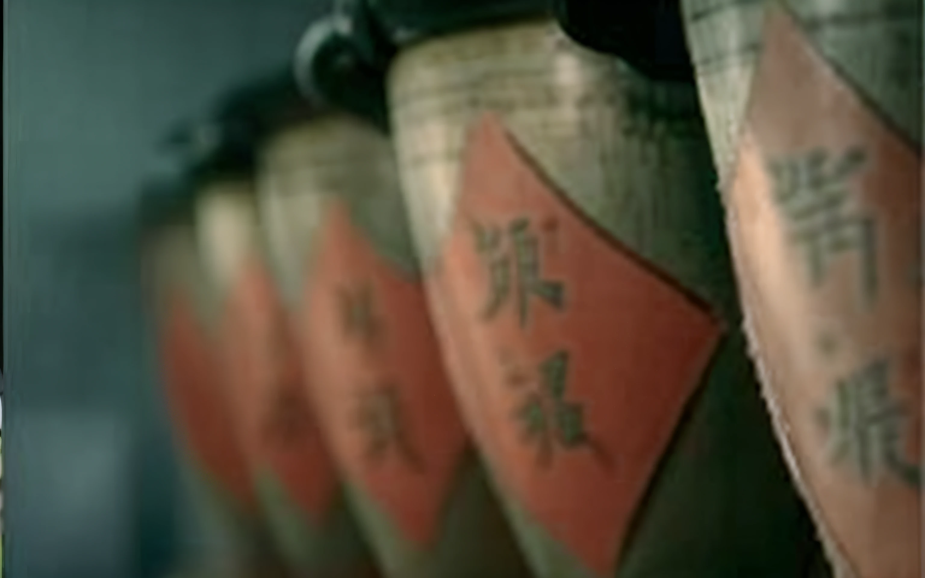 A row of vases has many red labels on the back, Wuxia, Wang Chen, kanliu666, with white kanji insignias, movie screen shot, Chinese traditional, subtitles, screenshots from movies, Chinese armor, in screenshot from the 300 movie, inspired by Fu Baoshi, video