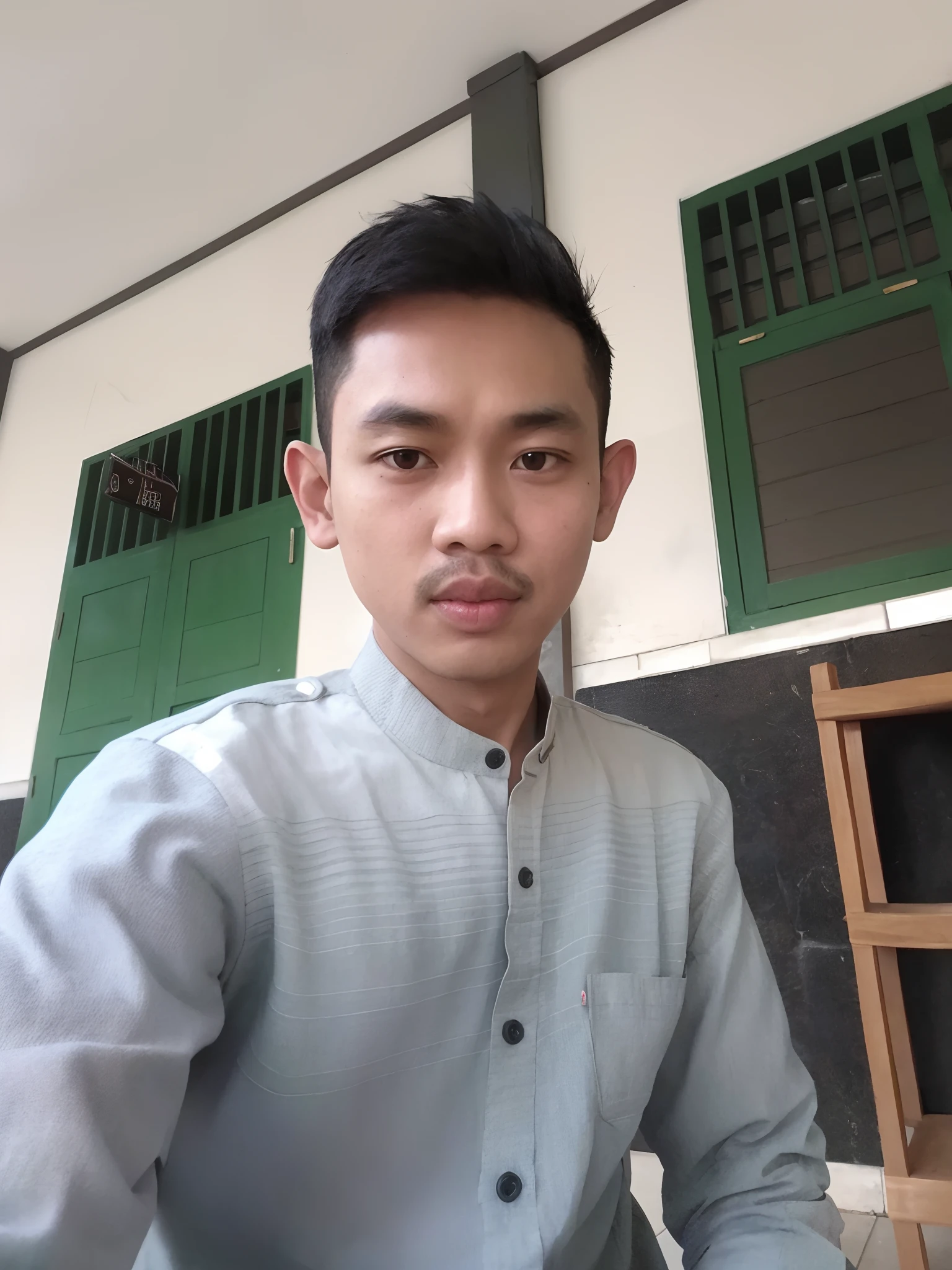 there is a man that is sitting down with a plate of food, raden saleh, potrait, student, with accurate face, young picture, south east asian with round face, protrait, ismail, ayan nag, nivanh chanthara, ramil sunga, front profile!!!!, thawan duchanee, by Abidin Dino