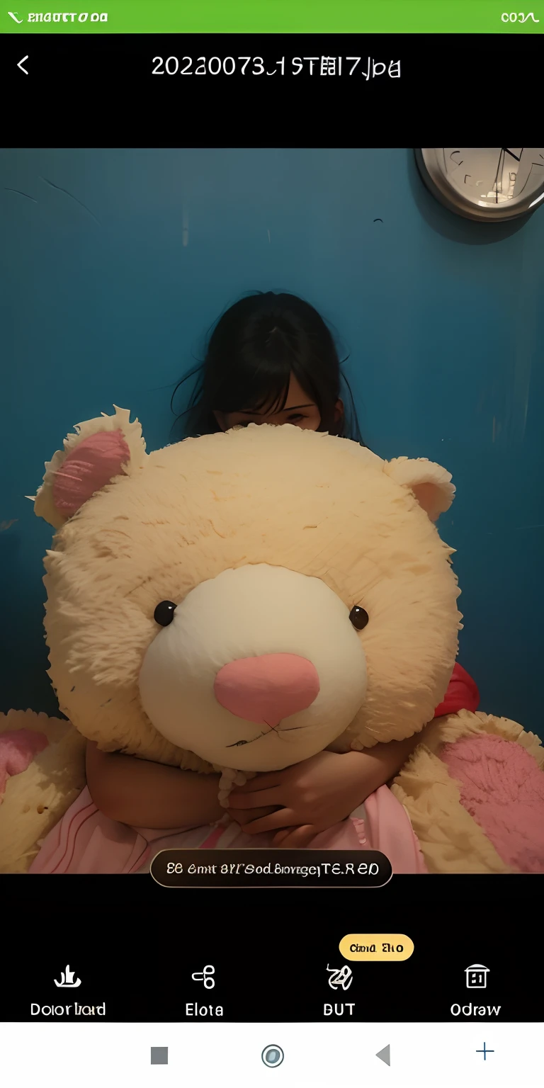 Girl hugging a teddy bare.