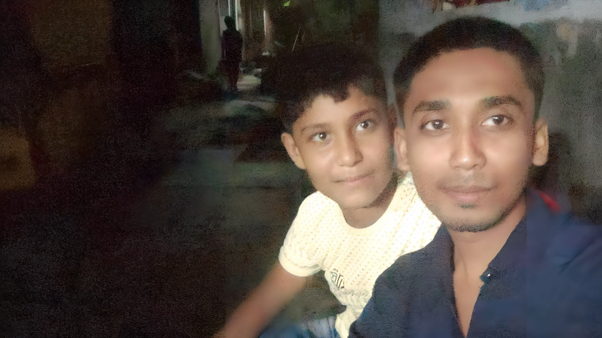 there is a man and a boy sitting together in a room, with a kid, facebook post, very very low quality picture, old picture, at night time, ghutra and egal, very clear picture, candid picture, selfie photo, childhood friend, ayan nag, high quality upload, a picture, picture, taken with the best dlsr camera, portait image