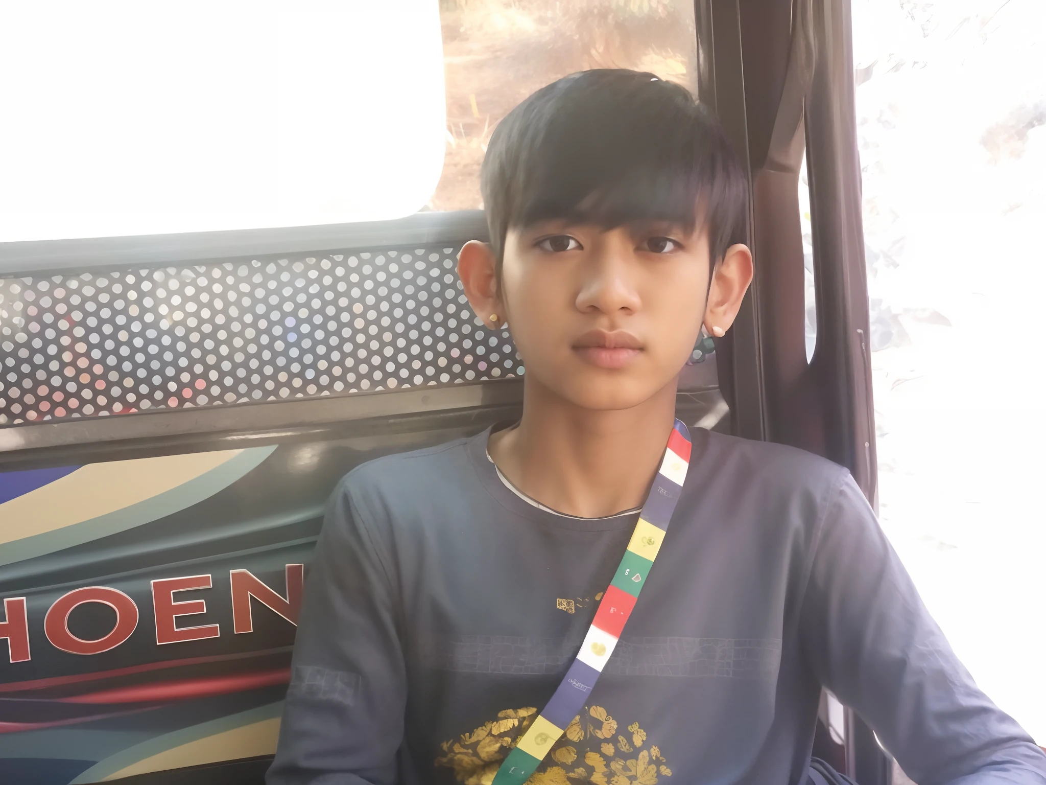 boy sitting in a bus with a colorful tie around his neck, ayan nag, young boy, reyyan, front profile!!!!, very very low quality picture, with kind face, riyahd cassiem, teen boy, innocent look, with accurate face, potrait, he is about 2 0 years old, he is about 20 years old, cute young man