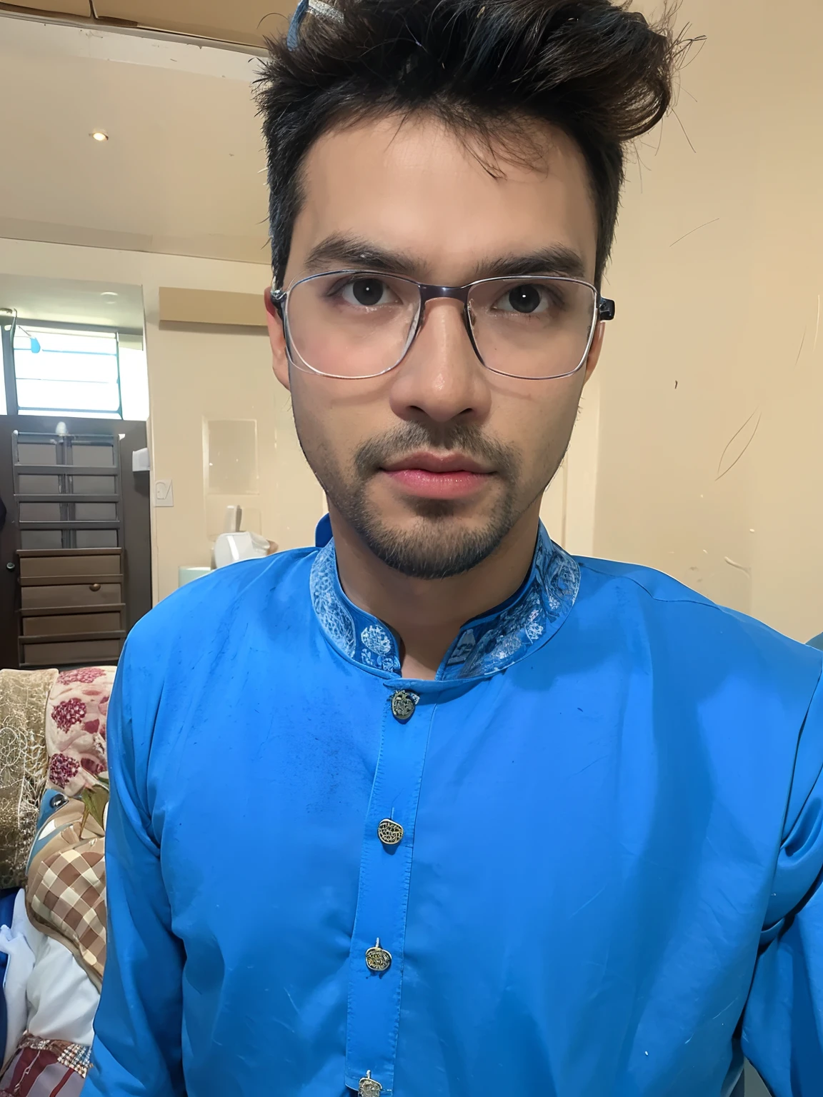 there is a man with glasses and a blue shirt posing for a picture, wearing a kurta, with accurate face, assamese aesthetic, wearing a silk kurta, with nerdy glasses and goatee, blue colored traditional wear, wearing small round glasses, very very low quality picture, with lovely look, good looking face, with glasses, wearing round glasses