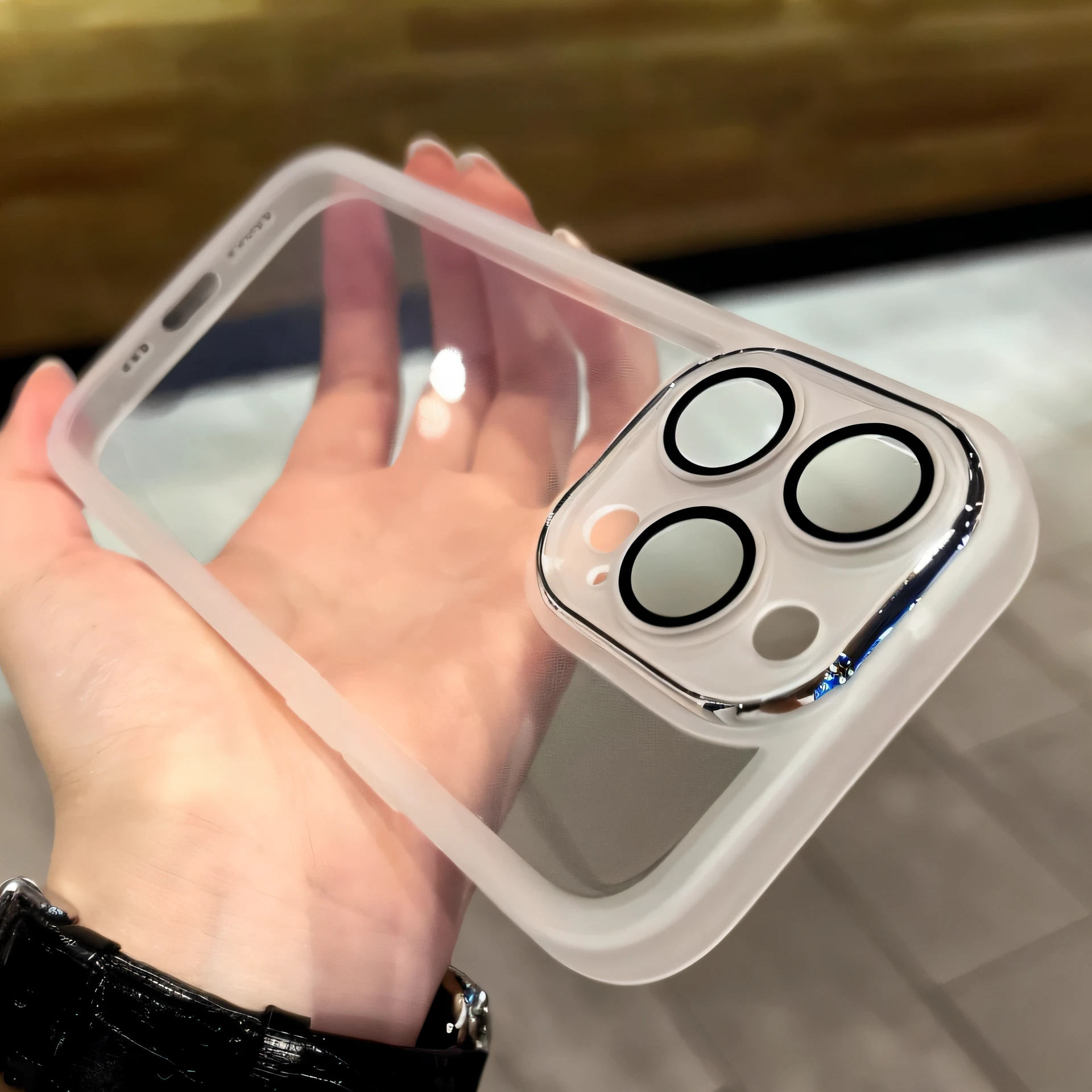 Someone was holding a transparent box,There are four circular buttons on it, iPhone 12, iphone 1 3, iPhone 13, 360*, cell cover style, iPhone 1 3 Pro Max, bottom angles, 👁🌹👾, white outline, 360º, medium close up shot, 🤬 🤮 💕 🎀, Fully Visible