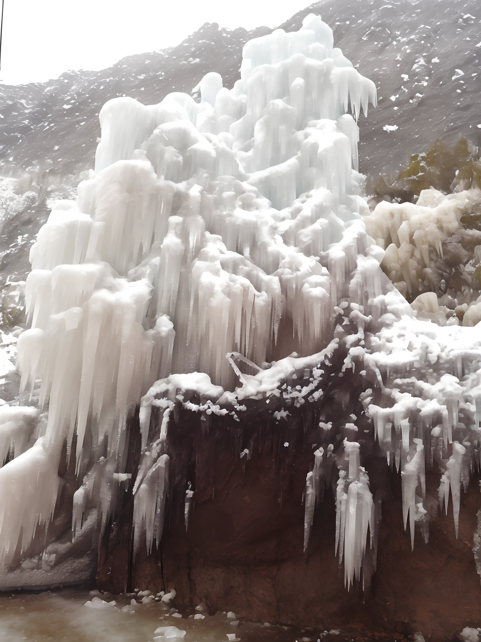 araffe covered in ice and icicles on a mountain side, frozen waterfall, dripping stalagtites, ice needles, icicles, frozen and covered in ice, icicle, draped with water and spines, covered in ice, snow and ice, in an ice storm, frozen ice statue, stalactites, icy landscape, entrapped in ice