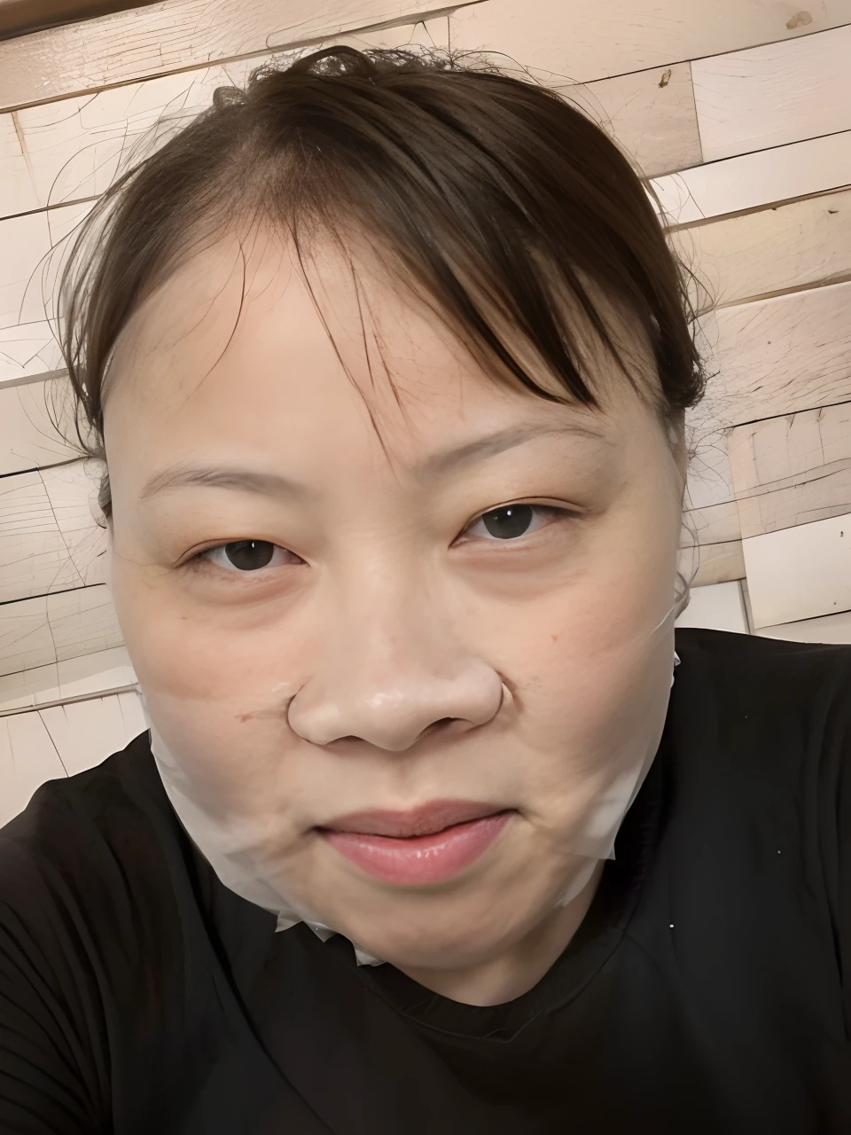 There is a woman in a face mask posing for a photo, face mask, the mask covers her entire face, her face is coated in a whitish, face mask, some of them use gask mask, full mask, Full round face!, mask off, No face mask, Full round face, one single mask, wearing a facemask, Wearing an angel halo-covered face