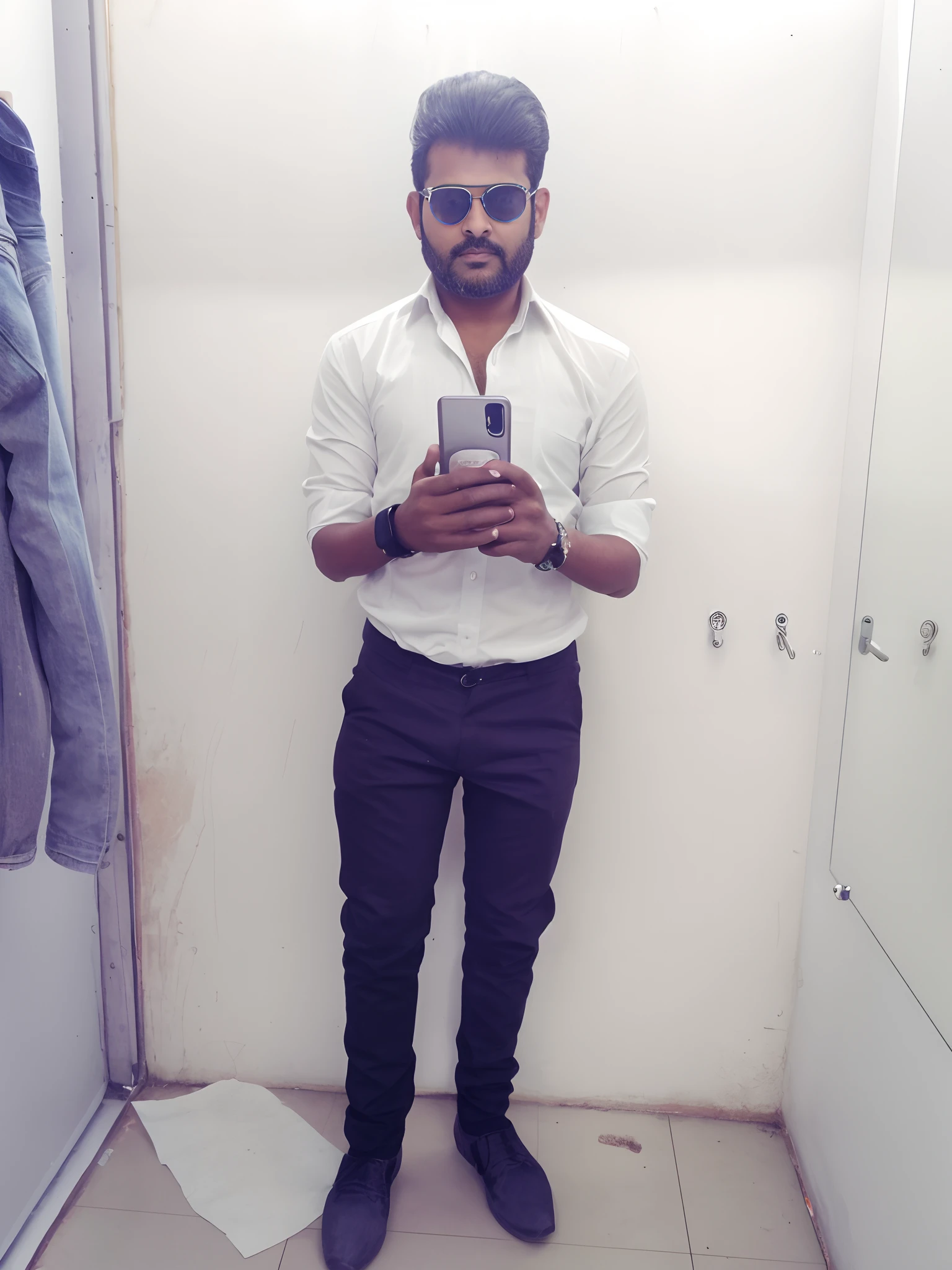 there is a man standing in a changing room holding a cell phone, full body picture, full body photogenic shot, full body in camera, full body photgraph, full body pictures, wearing in shirt, black tight pant, black shoes, very very high quality picture, candid picture, with accurate face, full body;, stylish pose, full body model, candid photo, very accurate photo, vinayak, selfie in front of mirror, ultra realistic face, detailed face, black goggles,