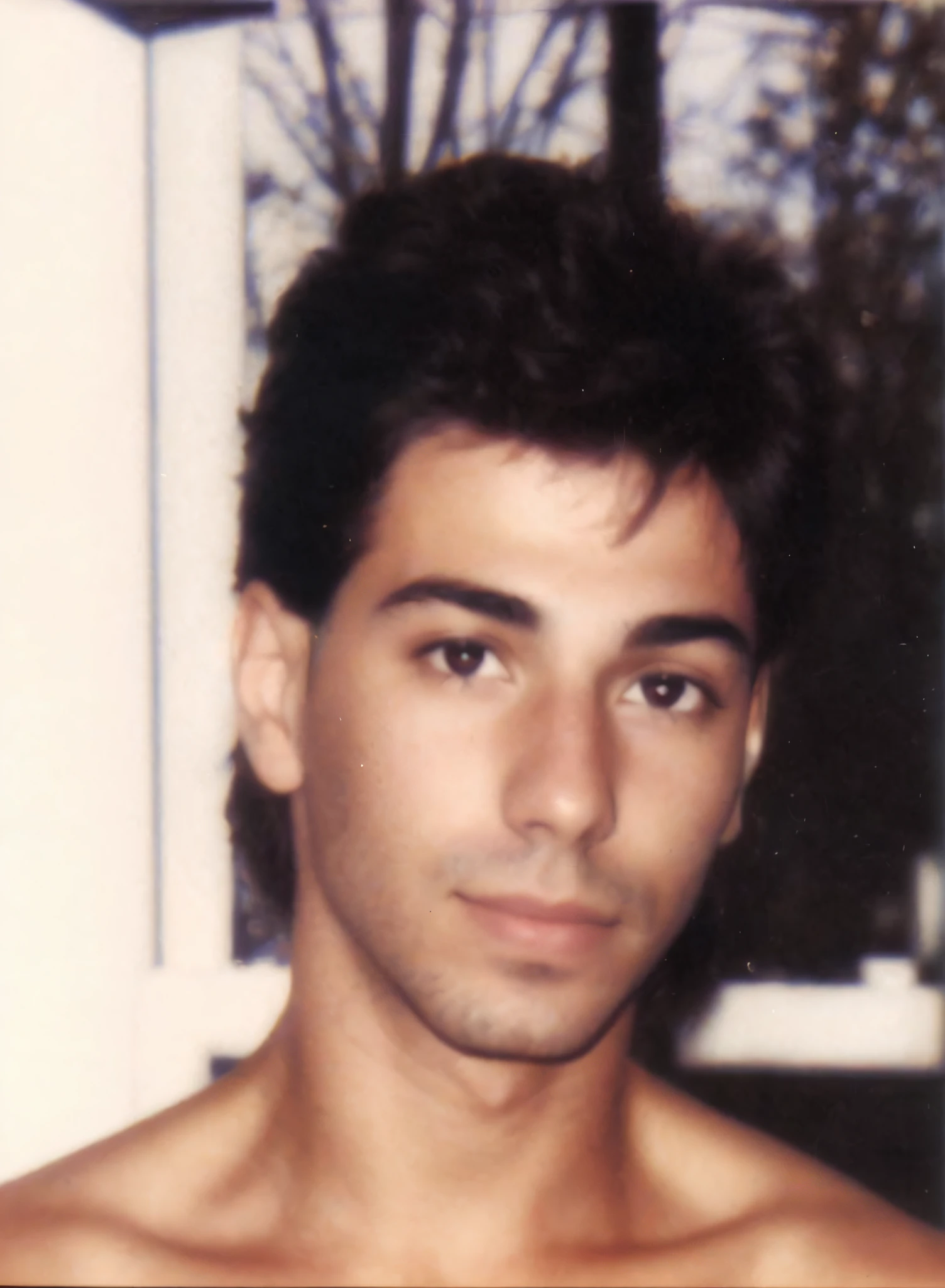 there is a man with no shirt on posing for a picture, around 1 , taken in the early 1990s, george doutsiopoulos, taken in the late 1980s, ricardo milos, about 3 5 years oldto, 1 9 8 0 s photo