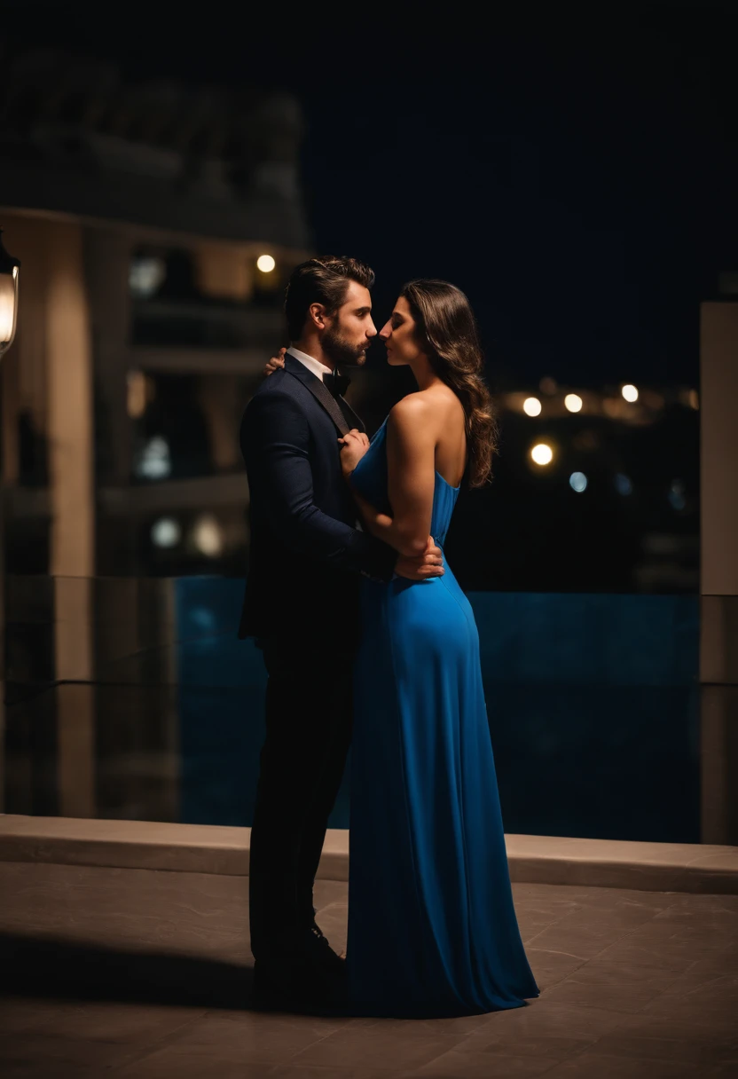 A couple man and woman he very handsome Italian 29 years old dark brown hair short vest suit is kissing passionate A beautiful young woman wears long blue dress on a luxurious terrace at night real photo clear face without deformations