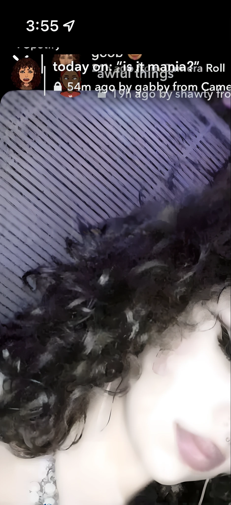 there is a woman with a cell phone that is showing a picture, curly haired, curly dark hair, messy curly hair, curly, curly hair, black curly hair, curly black hair, (dark shorter curly hair), with long curly hair, her face framed with curls, curly bangs, with curls, profile image, fair curly hair, with haunted eyes and curly hair