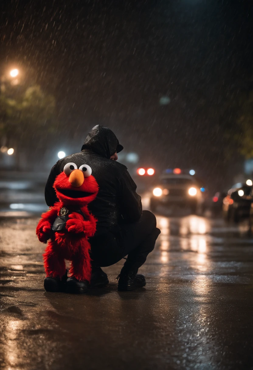 Elmo who is a red puppet with a orange nose is wearing a black hoodie in the pouring rain sitting down he is upset looking down at the ground it’s night time and u can see the rain going down he is upset and there is a gun in his hand and he is in hand cuffs with a pig puppet with make up in a police uniform in the cop car telling him to get in the background he is a grown up he is and adult