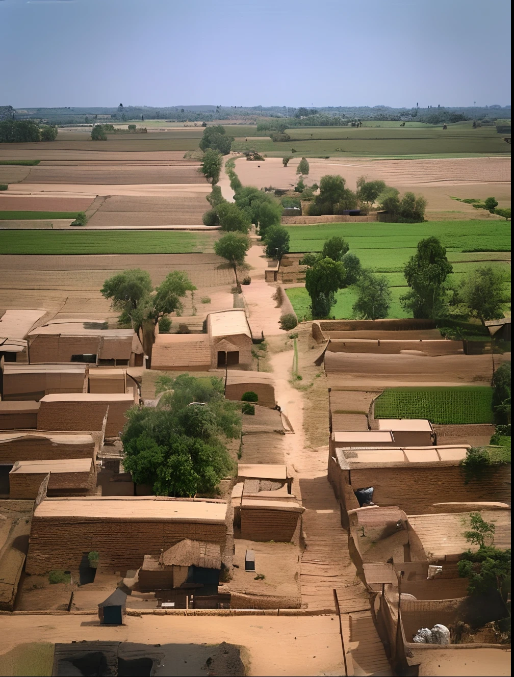 arafed village with a dirt road and a dirt road in the middle, distant shot birds eye view, view of villages, wide view of a farm, villages, farm land, photo taken from above, aerial view of an ancient land, village far away, very clear picture, bird's eye view, the photo was taken from afar, mud and brick houses