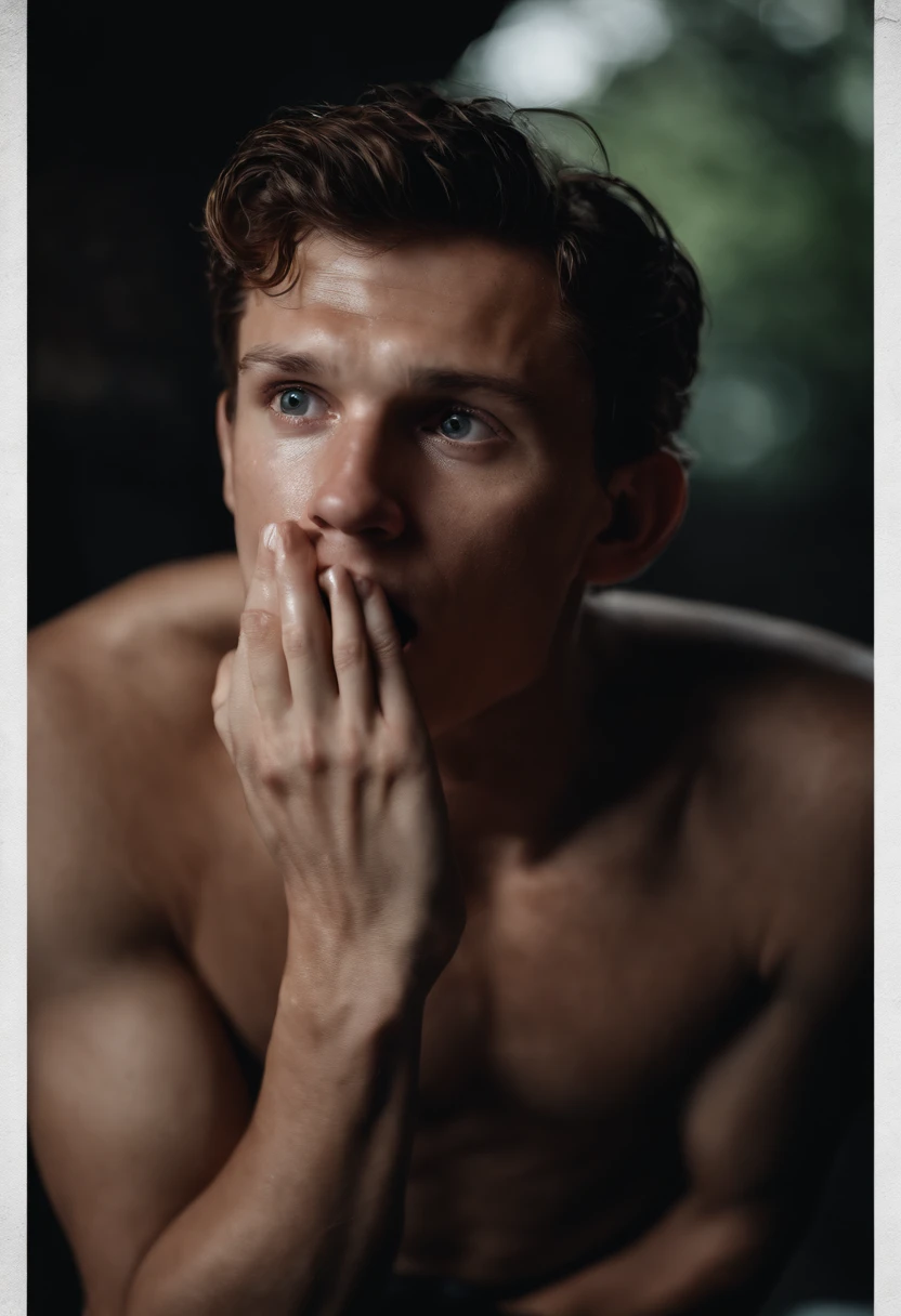 Portrait of tom Holland, wet, wearing only pants and with two fingers touching his mouth