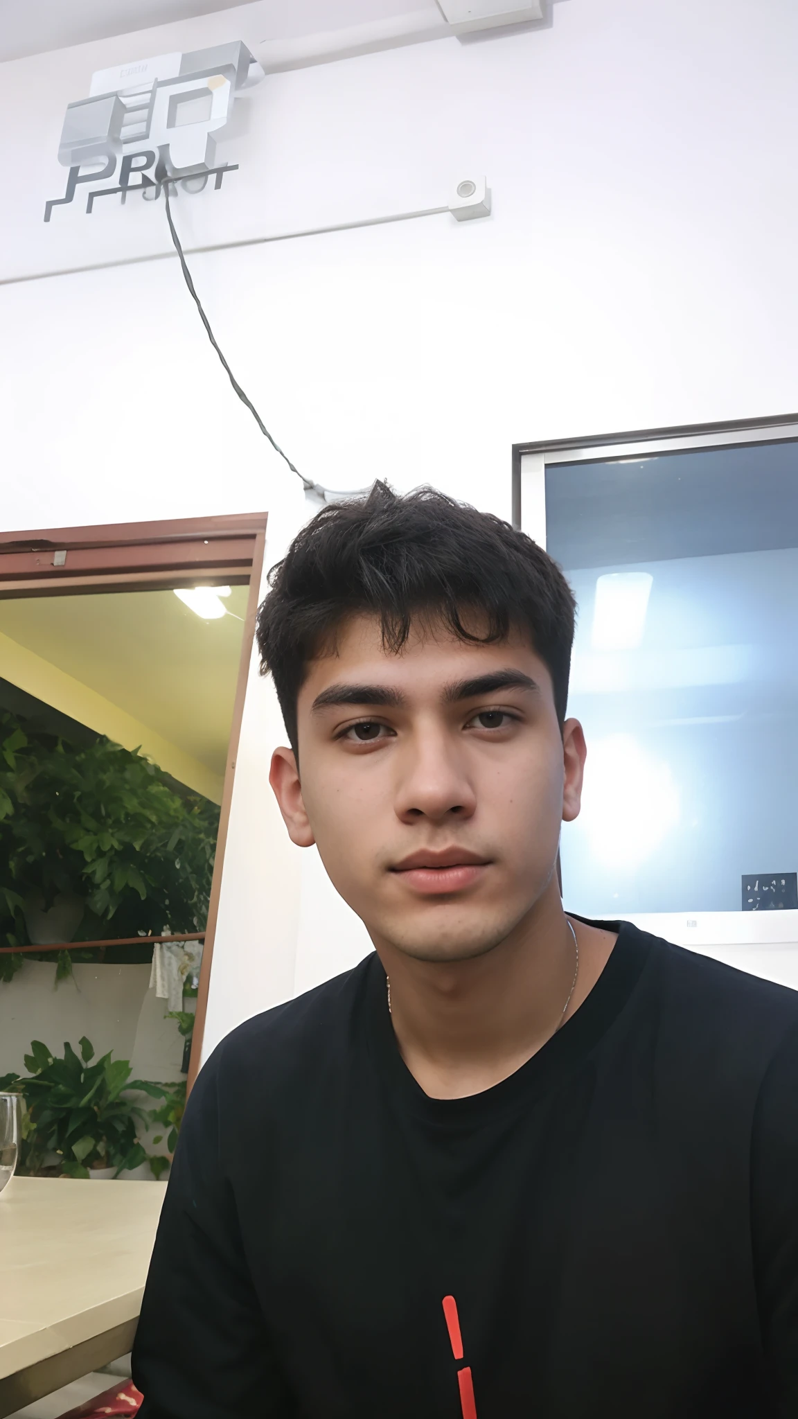 there is a man sitting at a table with a plate of food, 18 years old, frontal picture, around 1 9 years old, 1 6 years old, 2 2 years old, 21 years old, 2 3 years old, jose miguel roman frances, zigor samaniego, caio santos, 2 4 - year - old man, andres rios