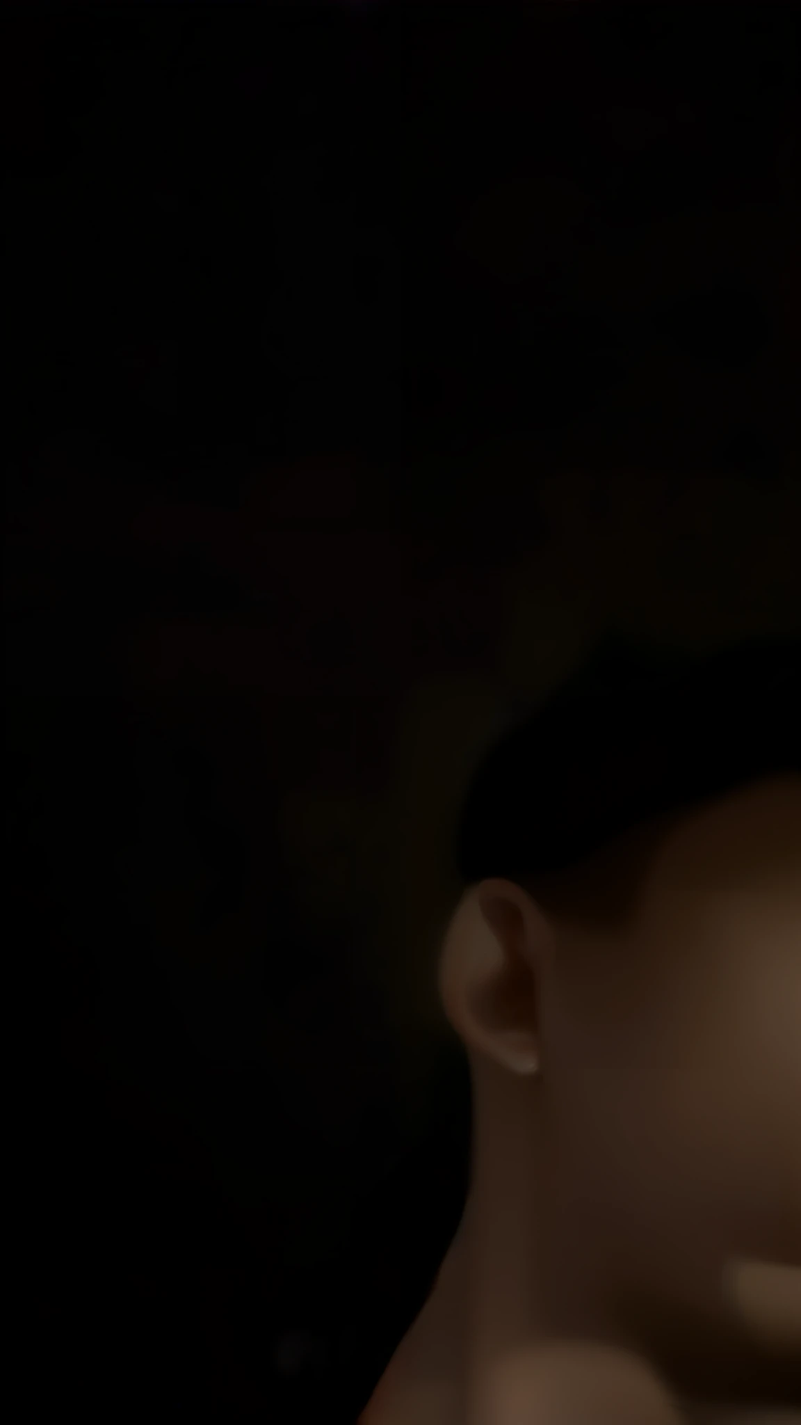 there is a man sitting in a car talking on a cell phone, distorted photo, candid!! dark background, blurry face, jimin\'s grecian nose, mouth slightly open, with small nose, aquiline nose!!, blurred face, very very low quality picture, ymmm and that smell, scary photo, very scary photo, low quality photo, thin nose