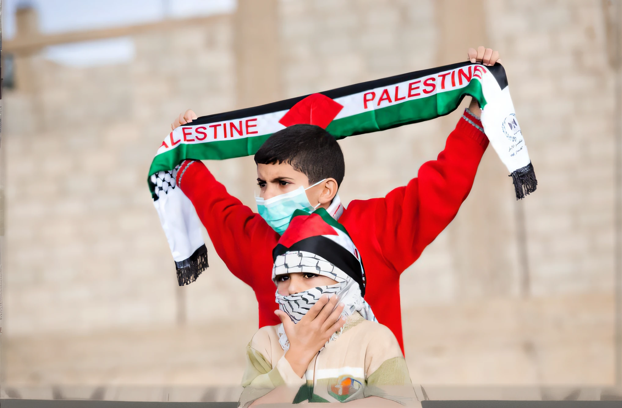 Boy holding Palestinian flag
