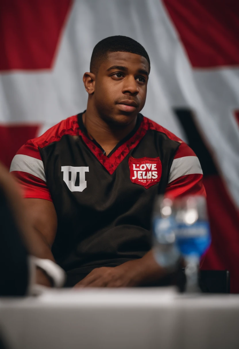 Portrait of Nick chubb. at a press conference wearing a shirt that says i love jews. and saquan barkley beside him wearing a isreal flag shirt