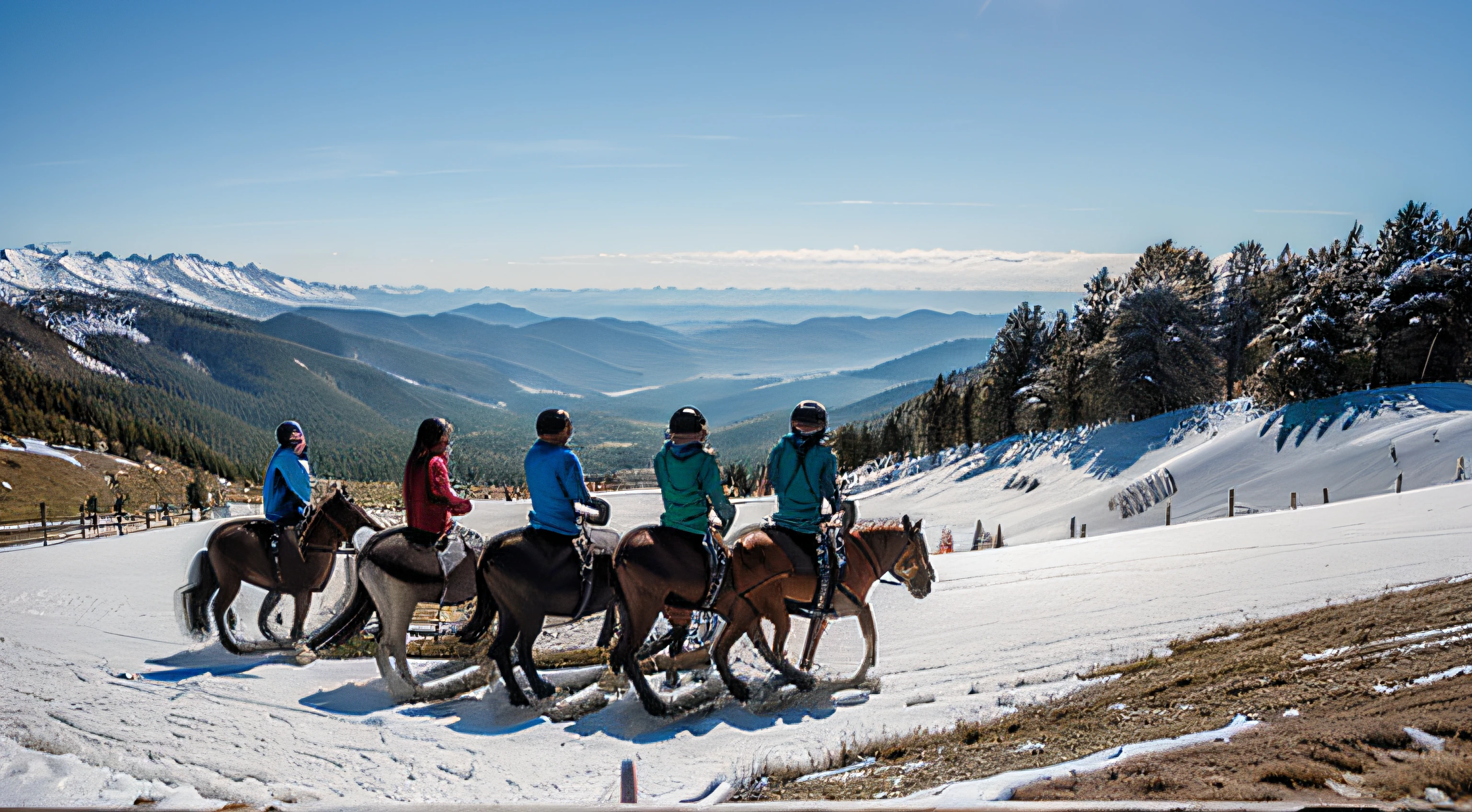 Several people on top of horses on the mountain