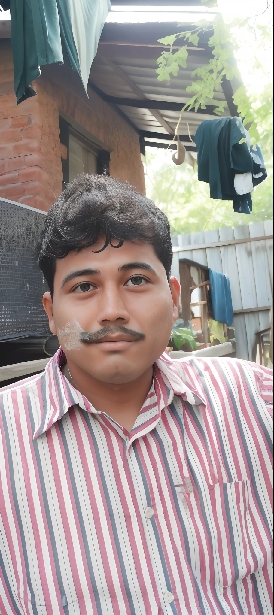 arafed man with a mustache on his face in front of a house, south east asian with round face, thawan duchanee, with round face, ayan nag, clean shaven face, nivanh chanthara, face picture, clean shaven wide face, shaven face, mildly scarred on his face, clean face