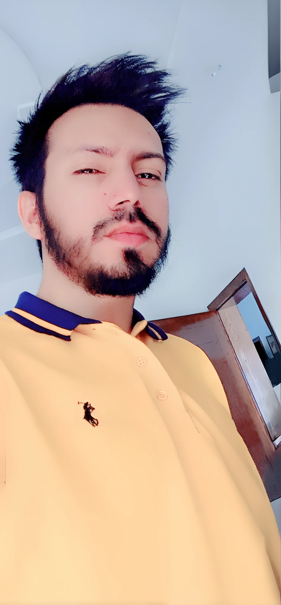 there is a man with a beard and a yellow shirt, very very low quality picture, wearing a modern yellow tshirt, khyzyl saleem, wearing polo shirt, edited in photoshop, without beard, around 1 9 years old, portait photo profile picture, profile pic, wearing in shirt, with accurate face, 8k selfie photograph, front profile!!!!