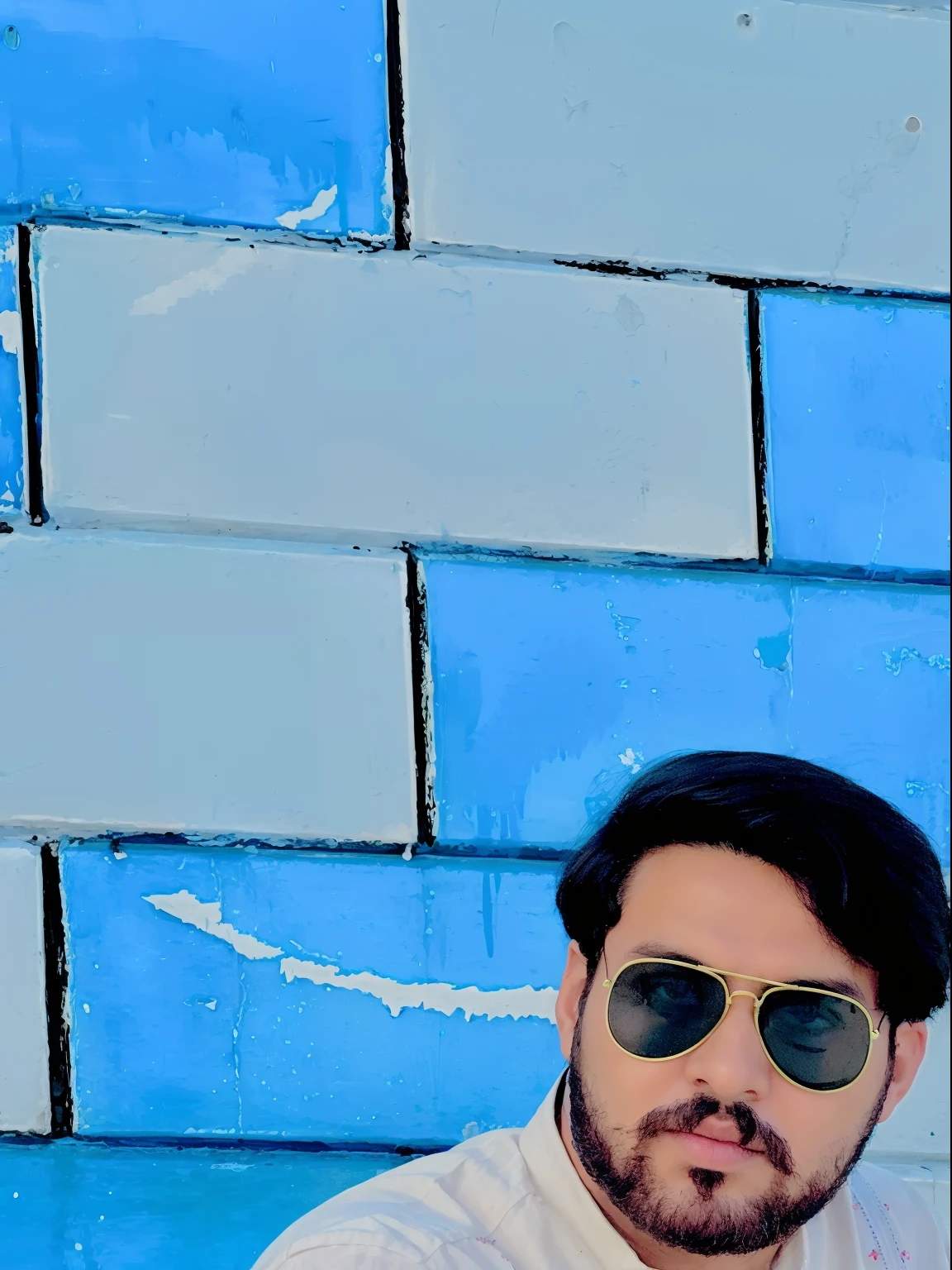 there is a man sitting on the steps of a building, kyza saleem, khyzyl saleem, very very low quality picture, by Riza Abbasi, handsome man, profile picture 1024px, inspired by Amir Zand, with a cool pose, an afghan male type, ash thorp khyzyl saleem