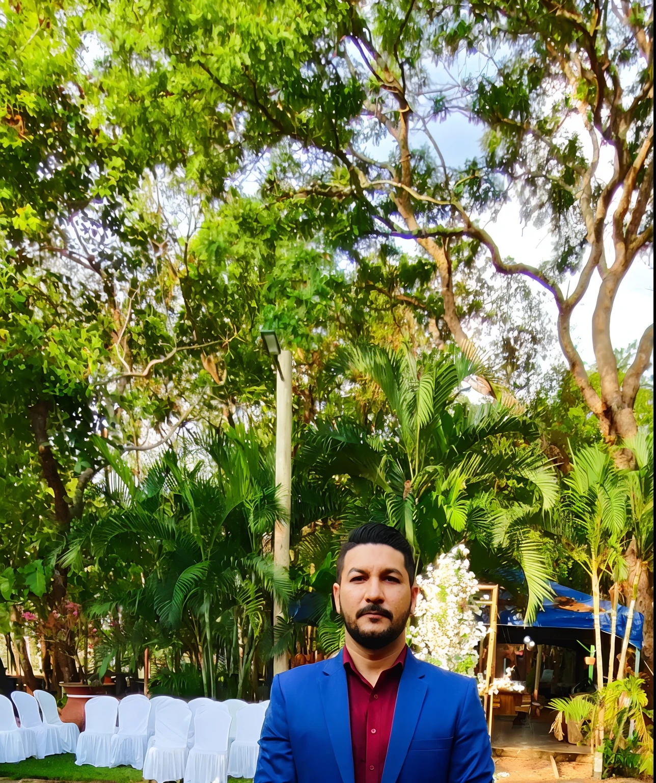 There's a man standing on a path in a park, vestido com um terno jodhpuri, ready for a meeting, em frente a um fundo de floresta, Fotografia tirada em 2 0 2 0, in a menacing pose, Directed by: Samuel Silva, imagem de qualidade muito baixa, Directed by: Luis Miranda, com uma pose cool, Directed by: David Ruby, full body photogenic shot