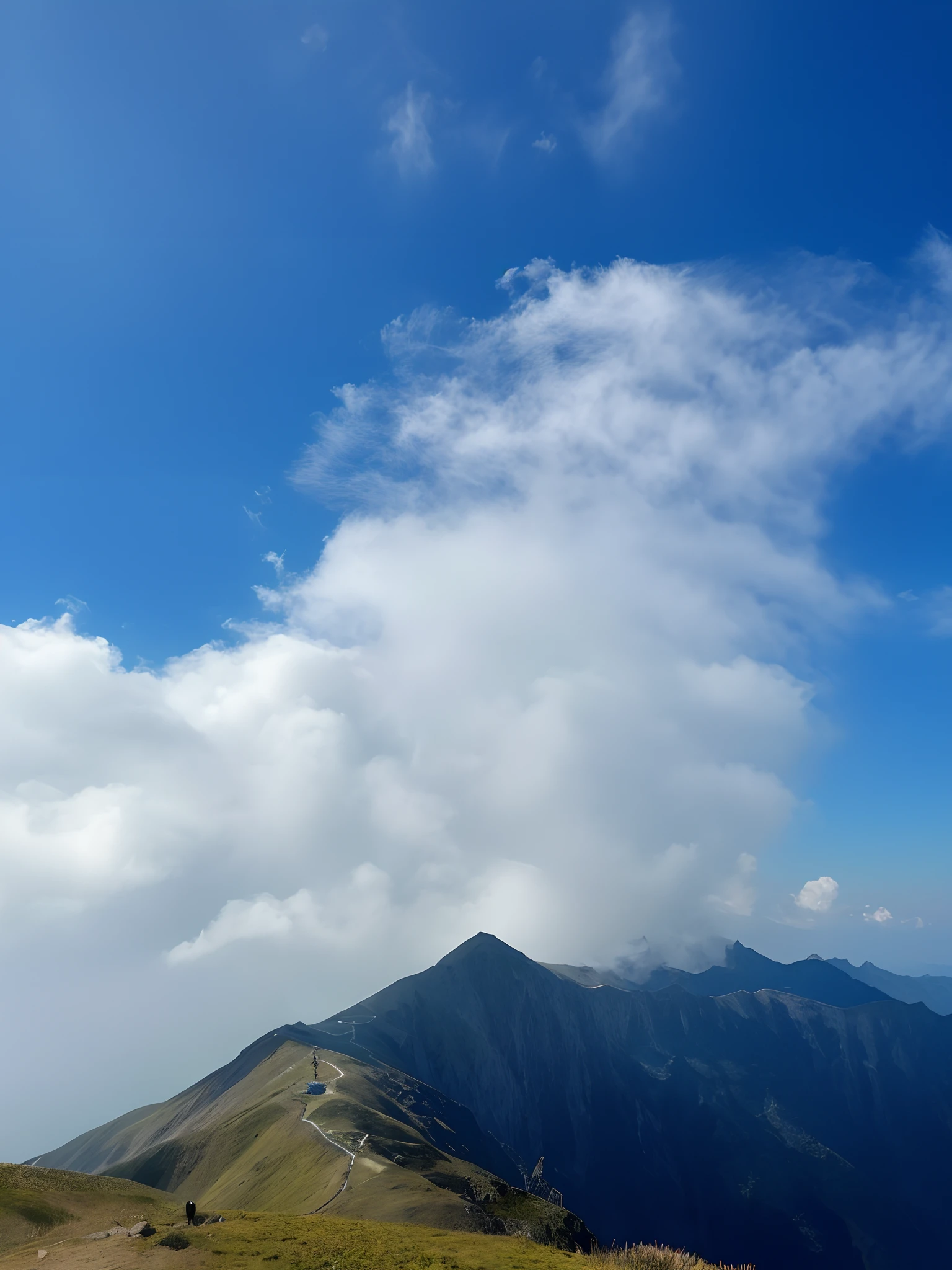 there is a man standing on a mountain top with a backpack, 8 k''. filling of the view, on cloud, heaven in the top, upon the clouds, with clouds in the sky, distant clouds, At the summit, hyper wide view, taken with a Sony A7R camera, At the top of a mountain, few clouds