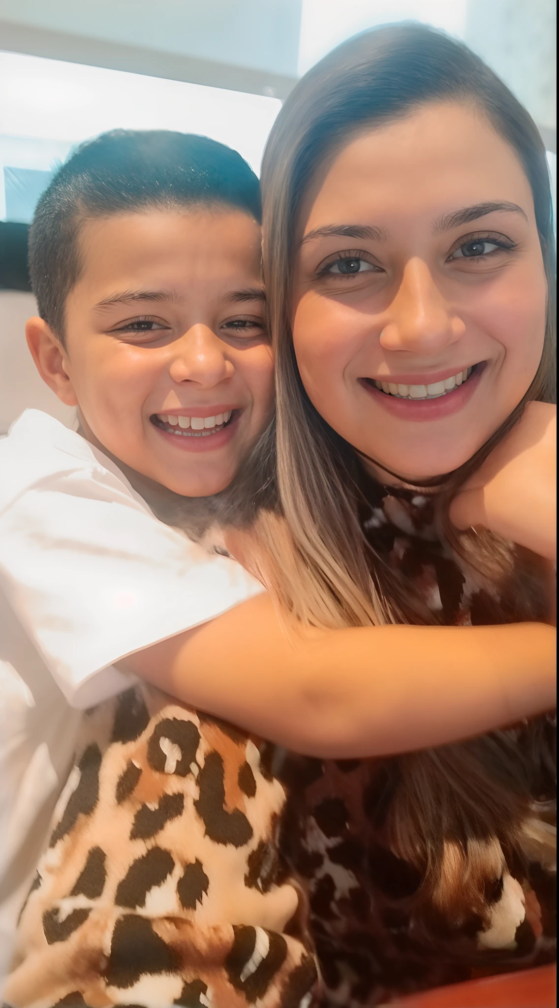 there is a woman and a boy that are sitting together, Directed by: Nandor Soldier, 3 5 year brazilian mother, by Amelia Peláez, mateus 9 5, Lorena Avarez, both smiling for the camera, happily smiling at the camera, imagem de qualidade muito baixa, with a , sorriso frito, imagem de perfil, Directed by: Judith Gutierrez