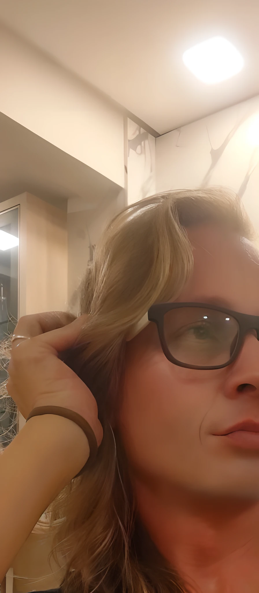 blond woman with glasses and black shirt brushing her hair in a mirror, taken in the early 2020s, androgynous person, profile image, androgynous male, about 3 5 years old, androgynous face, christian cline, 3 2 years old, 3 6 years old, inspired by Eugene Leroy, profile photo